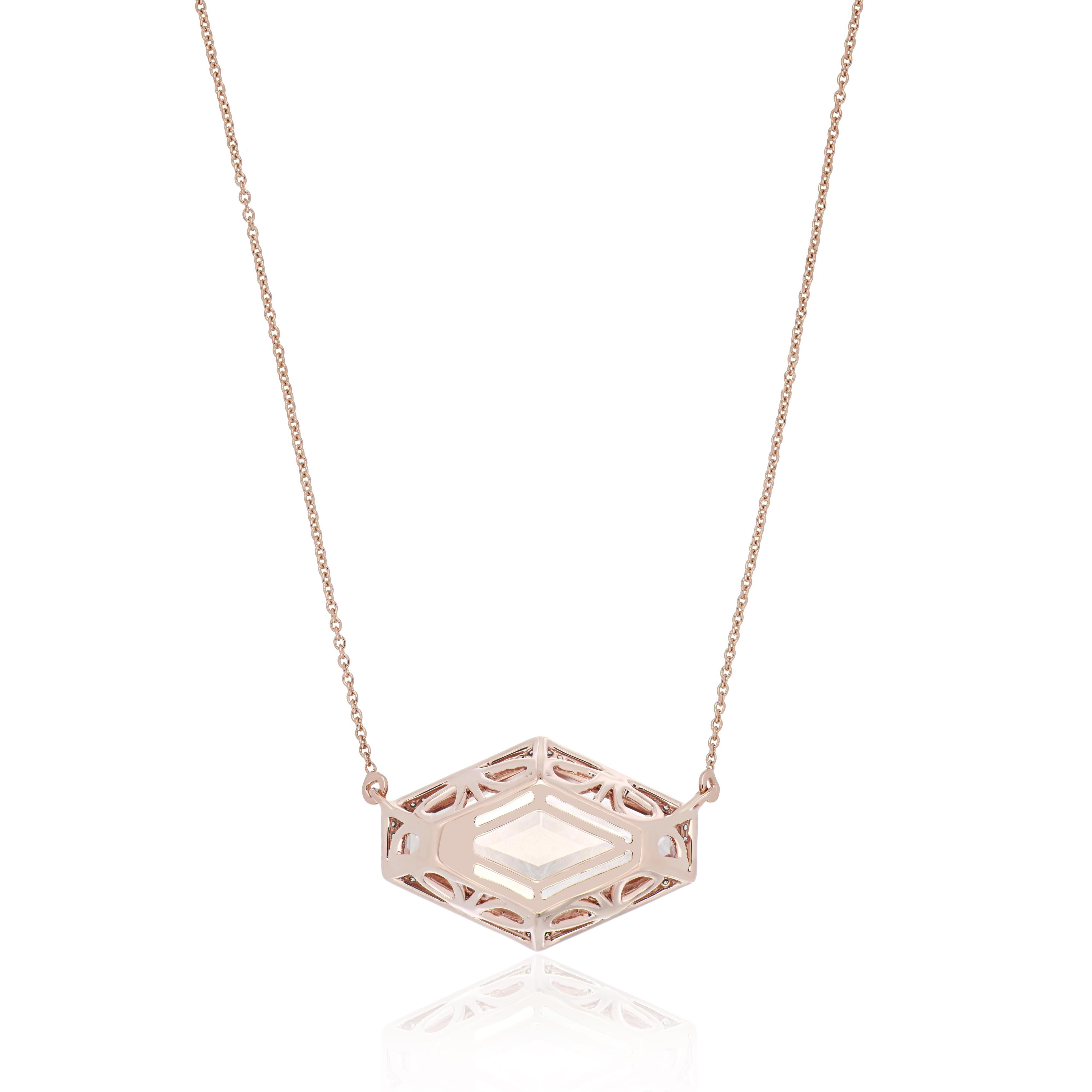 Elegant and exquisitely detailed Cocktail 14K pendant Necklace, center set with exclusively hand cut 13.84 Cts. (approx.) Fancy Hexagon Morganite. Surrounded with Diamonds, weighing approx. 0.17 ct. Beautifully Hand crafted in 14 Karat Rose