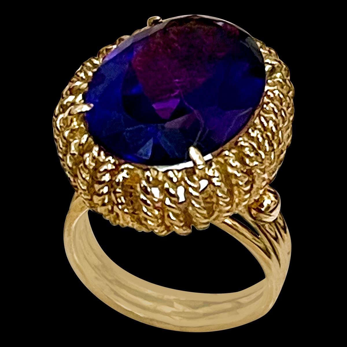 Approximately 13 Carat Natural Oval Citrine Cocktail  Ring in 18 Karat Yellow Gold, Estate 

This is a ring which has a  approximately 13 carat of high quality Amethyst stone. The stone is 14X19 MM
Color and clarity is very nice.
 No diamonds , no