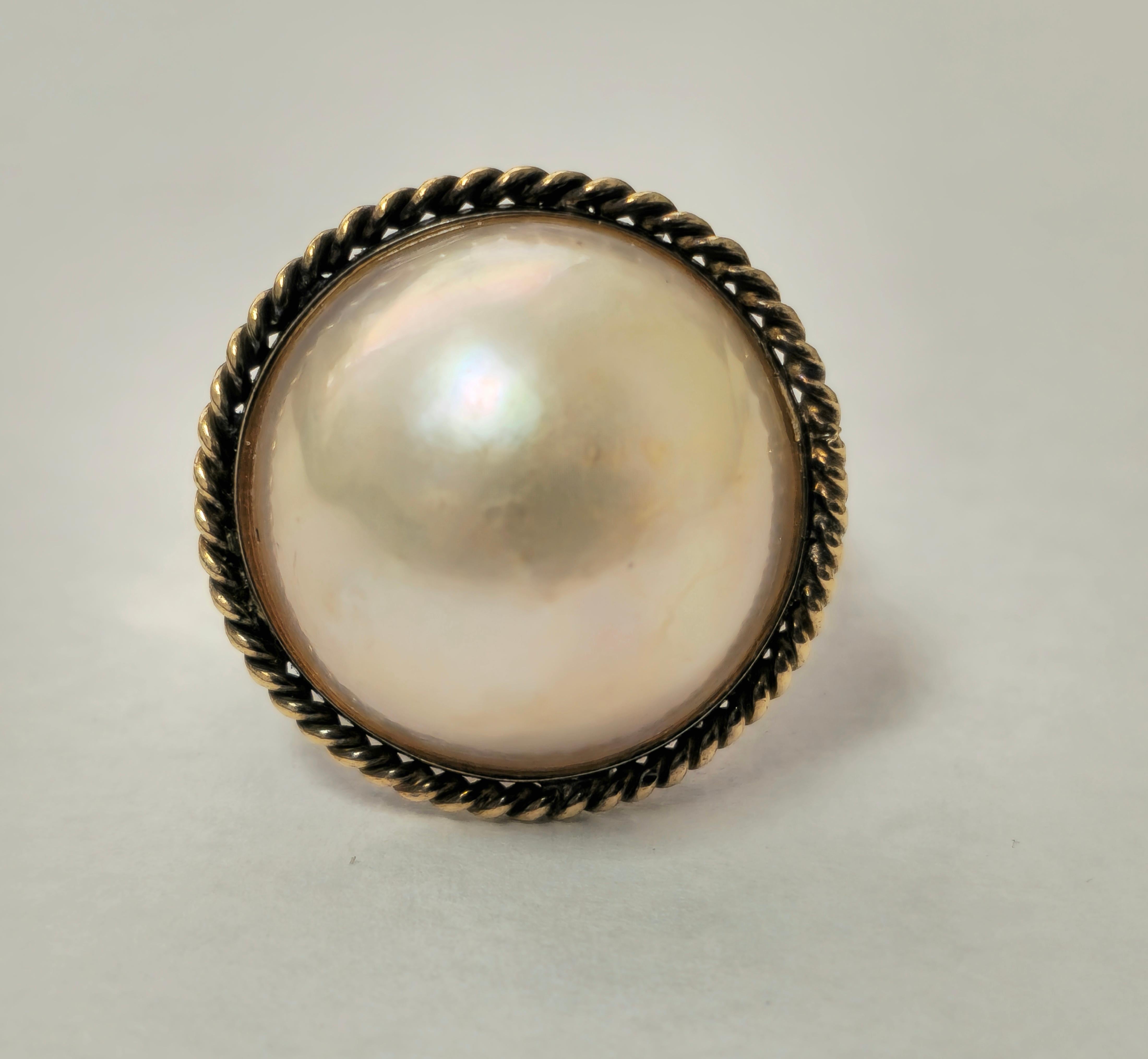 Embrace timeless sophistication with our Antique Women's Pearl Ring, crafted in luxurious 18k yellow gold. Adorned with a stunning 13-carat pearl, this exquisite piece exudes elegance and grace. With a total weight of 7.70 grams and free ring