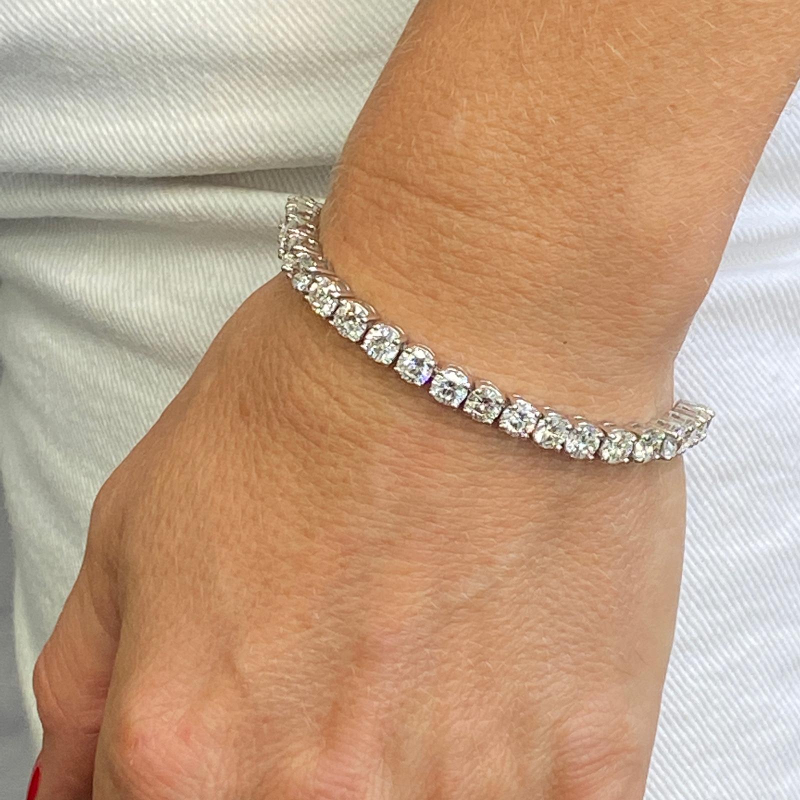 Stunning 13-Carat Diamond Tennis Bracelet. This classic tennis bracelet features 36 round brilliant cut diamonds graded G-I color and VS2-SI2 clarity. The beautifully matched diamonds measure 5mm in width and the bracelet measures 6.5 inches in