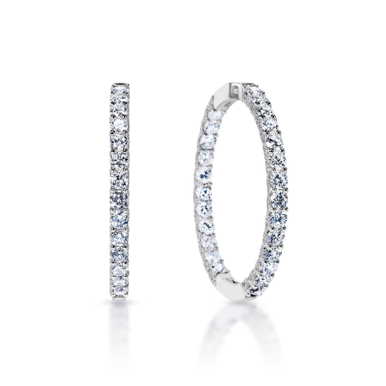 Diamond Hoop Earrings:

Carat Weight: 13.19 Carats
Shape: Round Brilliant Cut
Metal: 14 Karat White Gold
Style: Hoop Earrings