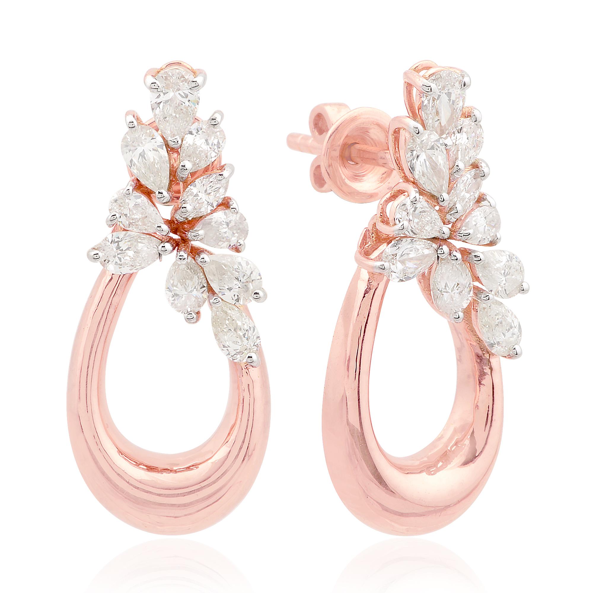 Adorn yourself with the breathtaking beauty of these 1.3 Carat SI/HI Pear Marquise Diamond Dangle Earrings, expertly crafted in alluring 14 Karat Rose Gold. These exquisite earrings are a fusion of timeless elegance and contemporary glamour,