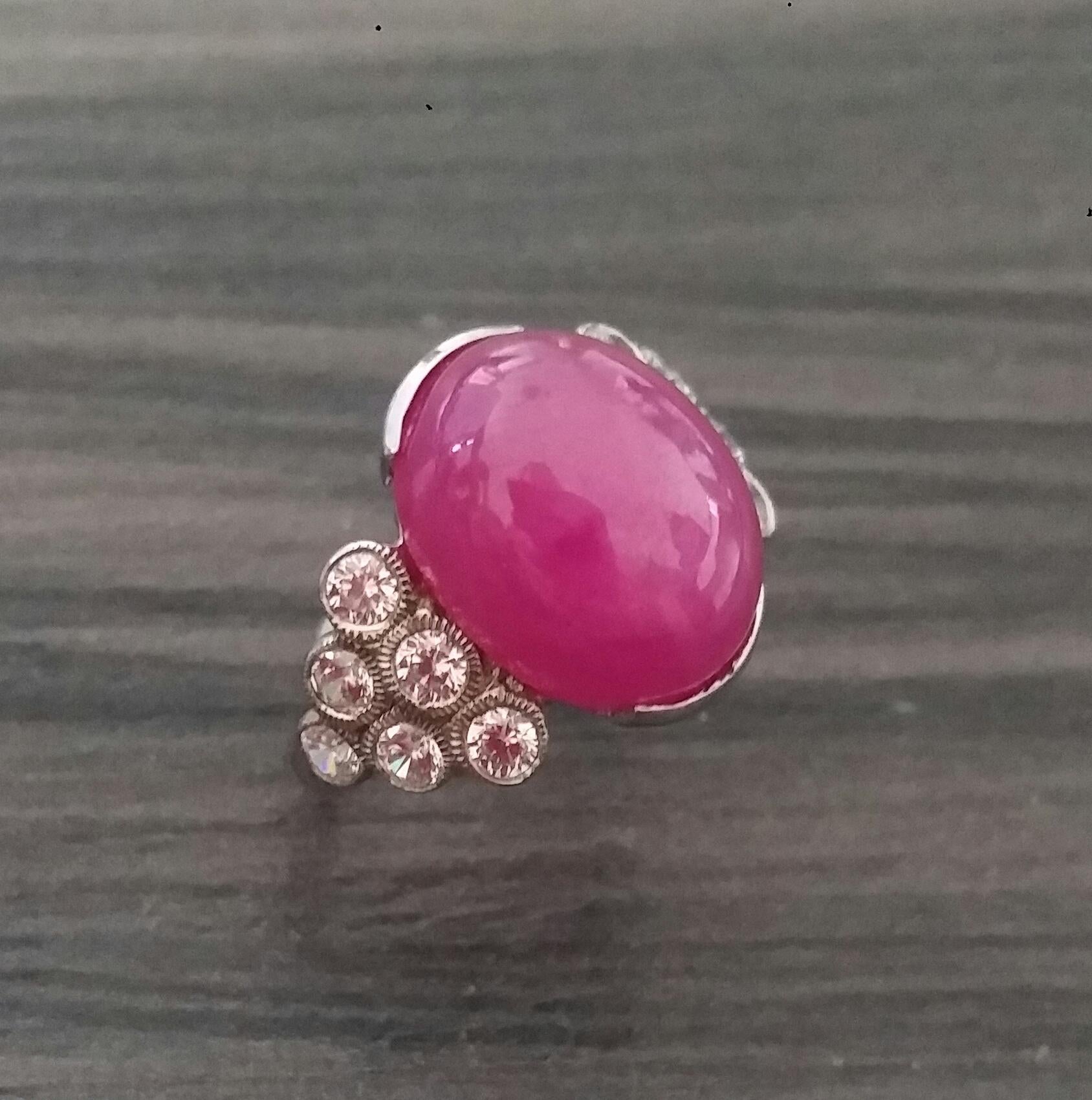 13 Carats Natural Ruby oval cabochon ( 11 mm. x 15 mm.) set with 3,7 grams of 14 kt white gold, 12 round full cut diamonds of 0,05 ct. each = 0,6 carats total diamonds weight
Ring Shank American size # 7 1/2
Height 25 mm
Weight 5,20 grams
In 1978