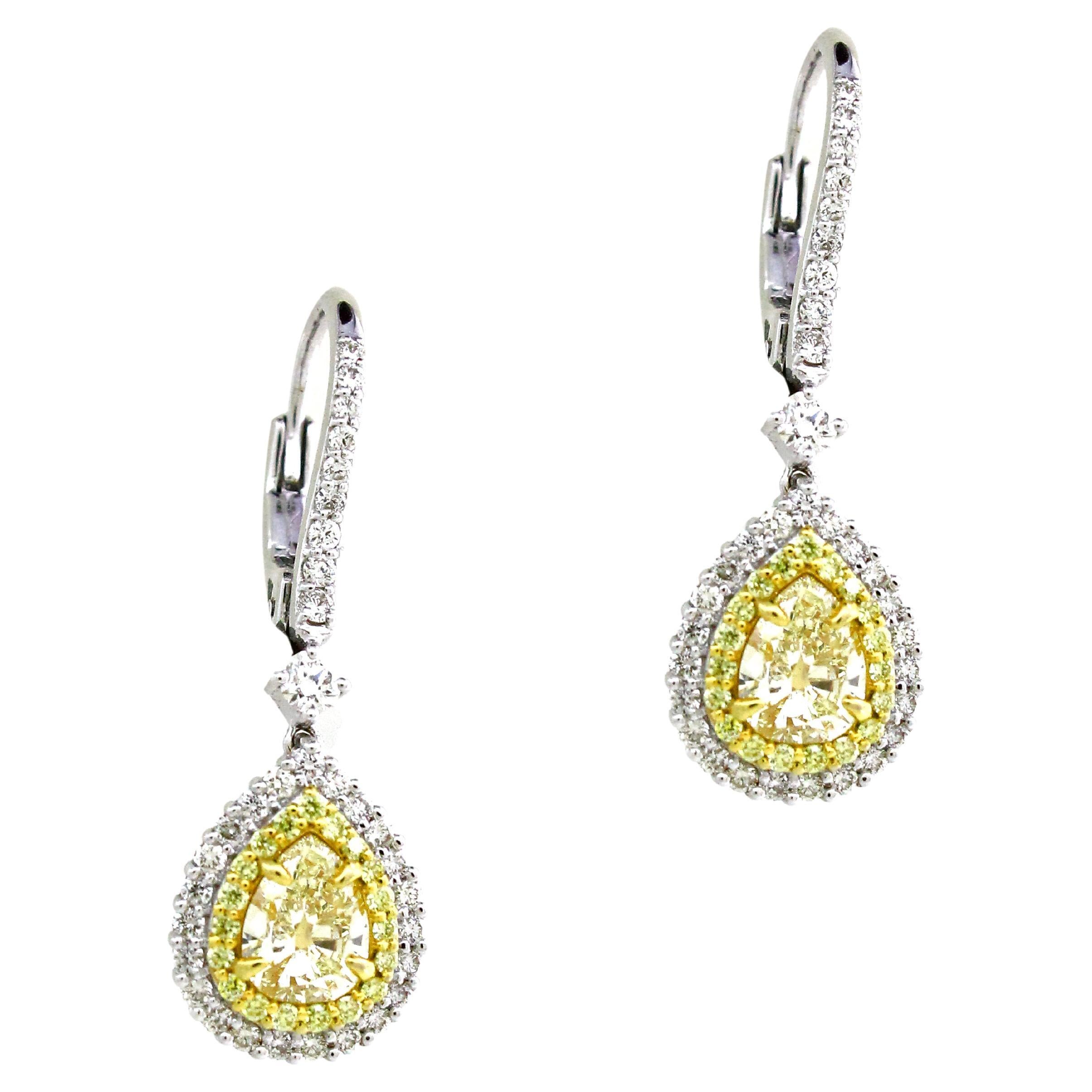 1.3 Carats yellow diamonds pear cut earrings For Sale