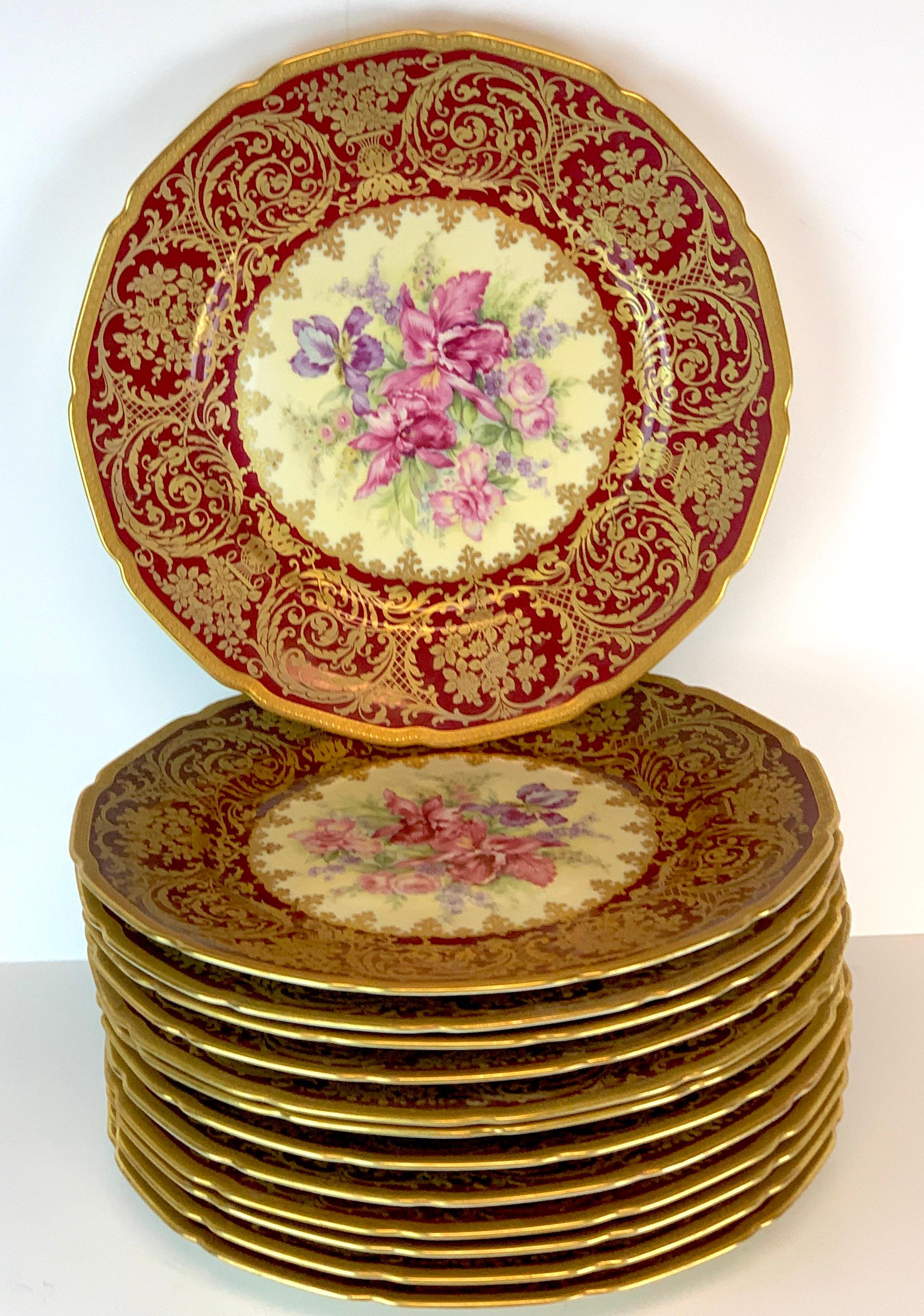 13 exquisite Rosenthal garnet gilt orchid and floral service plates, special order, each one richly decorated with wide red and gold borders, with vibrant floral centers, all decorated the same. Each one numbered
#6129/73.