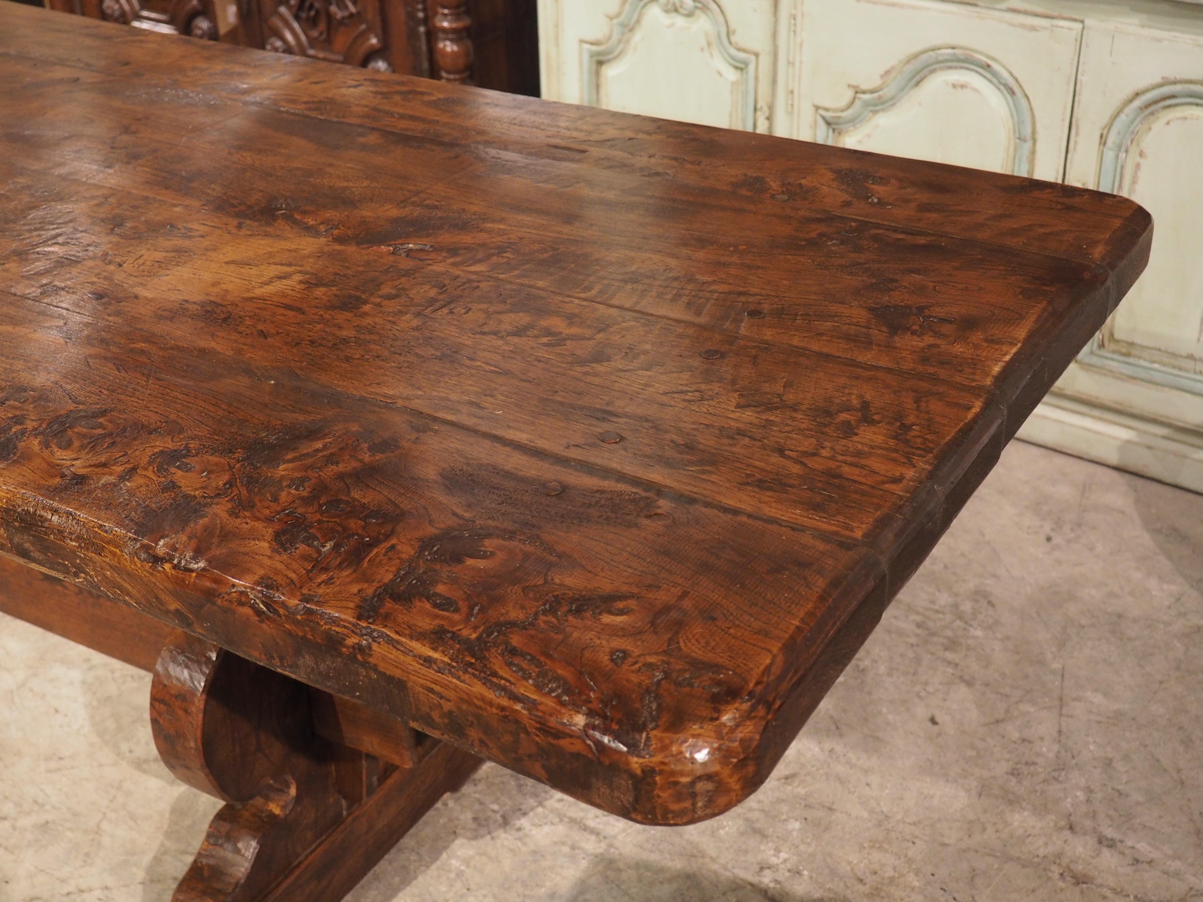 Hand-carved in chestnut in the early 1800s, this 13 foot long dining table was recently found in a chateau near Coat Nizan (see the second image for a photo as the table appeared in the chateau). Coat Nizan is a hamlet by Le Guindy River in