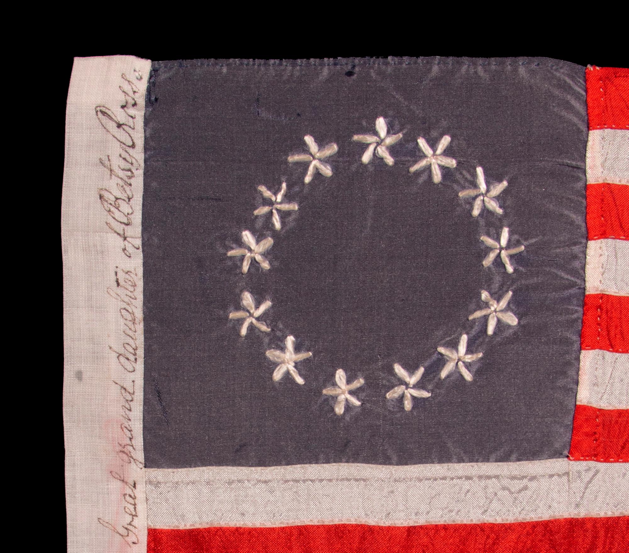 13 HAND-EMBROIDERED STARS AND EXPERTLY HAND-SEWN STRIPES ON AN ANTIQUE AMERICAN FLAG MADE IN PHILADELPHIA BY SARAH M. WILSON, GREAT-GRANDDAUGHTER OF BETSY ROSS, SIGNED & DATED 1911:

13 star American national flag, entirely hand-sewn by Sarah M.