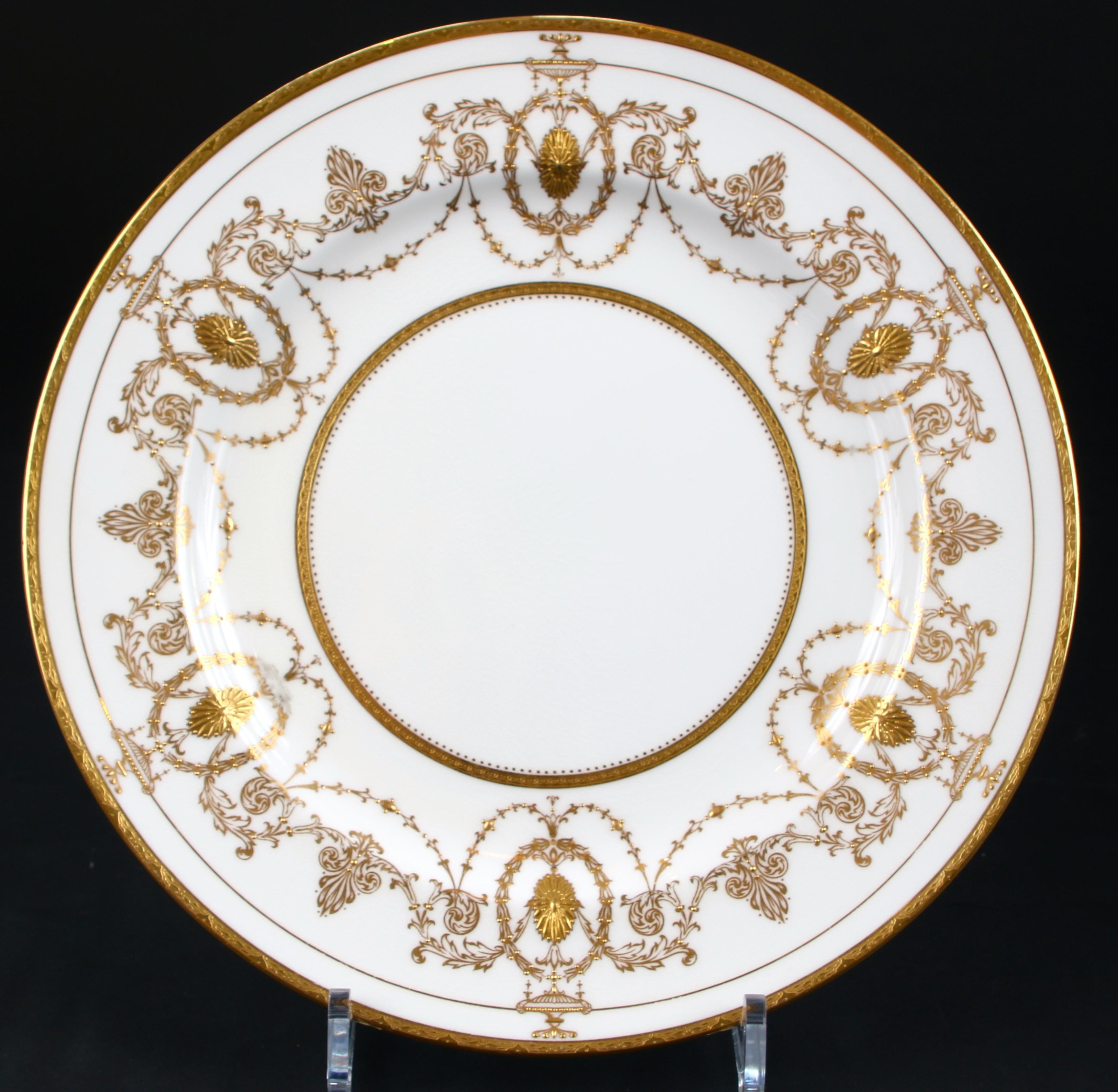 Antique Minton, Stoke-on-Trent, England, Adam-style plates, feature encrusted medallions and urns linked by foliate swags with s gold beading, Pattern H528, one of Minton's famous 