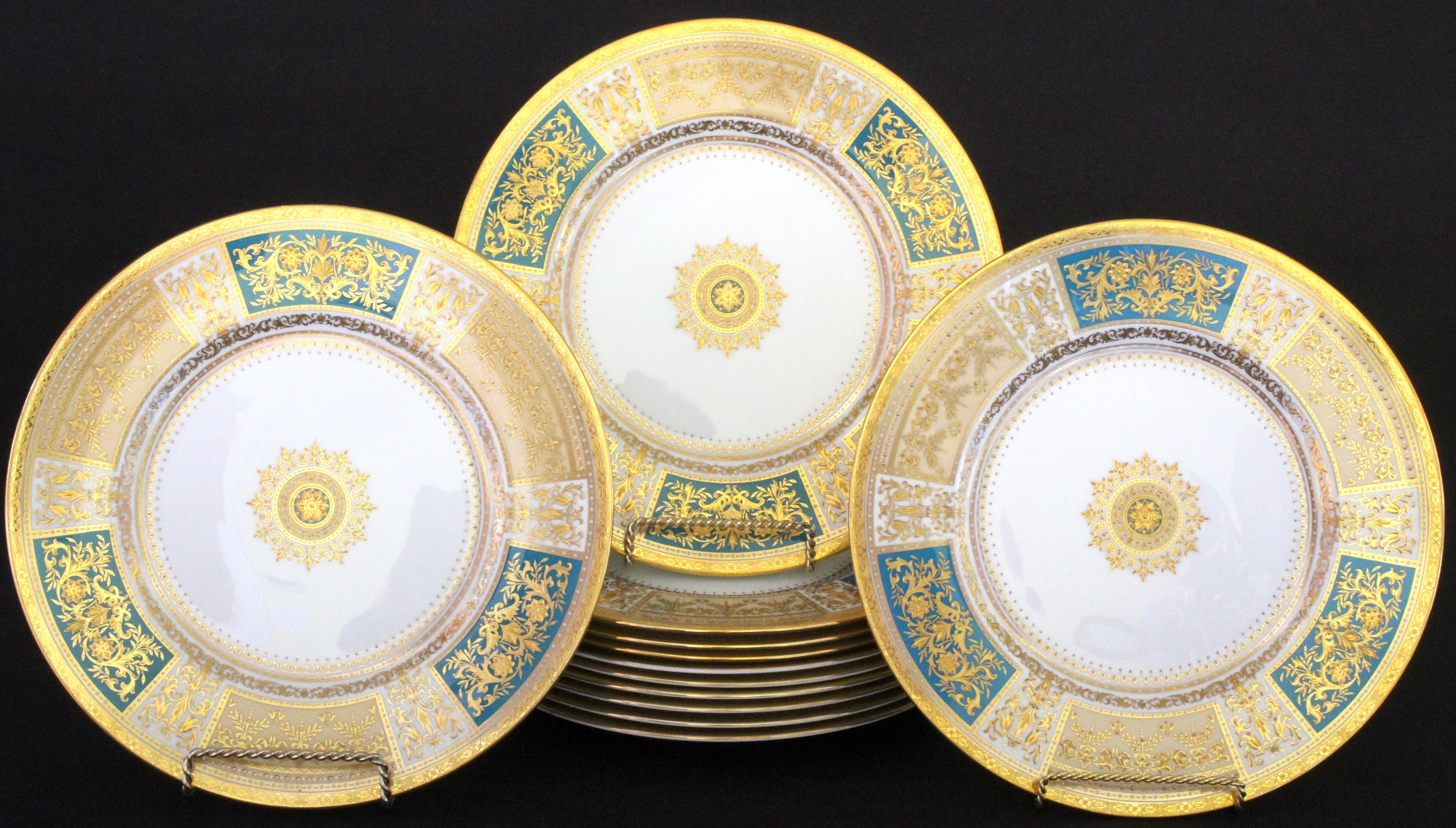 This set of Minton, Stoke-on-Trent, England, master-gilder service or dinner plates feature six 22-karat gold-beaded panels, three cream and three turquoise, each decorated with ornate and elaborate ornaments composed of flowers, laurel, lotuses,