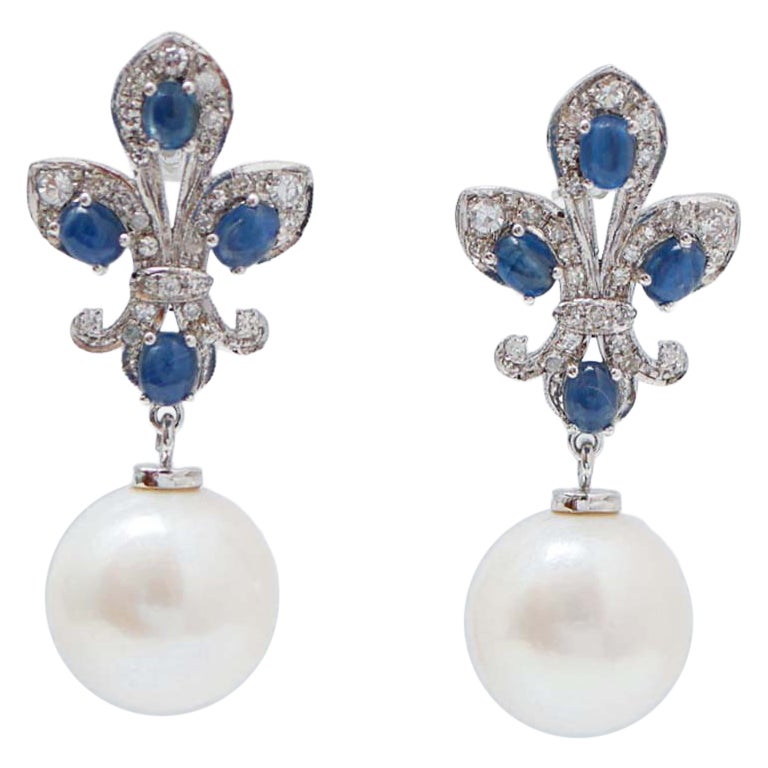 13 Mm Pearl, Sapphires, Diamonds, 14 Karat White Gold Earrings.