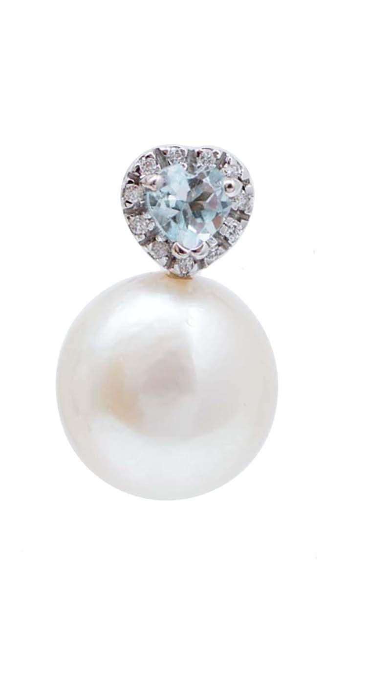 Fantastic earrings in 18 kt white gold structure mounted with an heart aquamarine surrounded by diamonds and, as pendant, a pearl.
These earrings were totally handmade by Italian master goldsmiths and they are in perfect conditions.
Diamonds 0.18