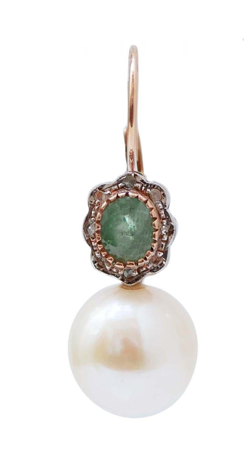 Retrò earrings in 9 kt rose gold and silver structure mounted with an emerald surrounded by diamonds and, below, a pearl.
These earrings were totally handmade by Italian master goldsmiths and they are in perfect conditions.
Diamonds 0.17 ct
Emeralds
