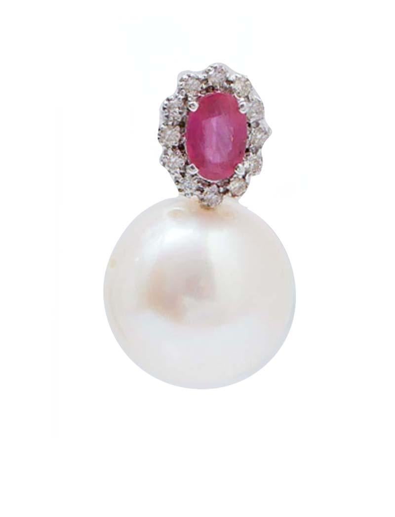 Elegant modern earrings in 18 kt white gold structure mounted with a central ruby surrounded by diamonds and, below, a pearl.
Diamonds 0.28 ct
Rubies 1.13 ct
Pearls 6.10 gr
Total Weight 8.10 gr
RF      G      GGEE

For any informations, feel free to