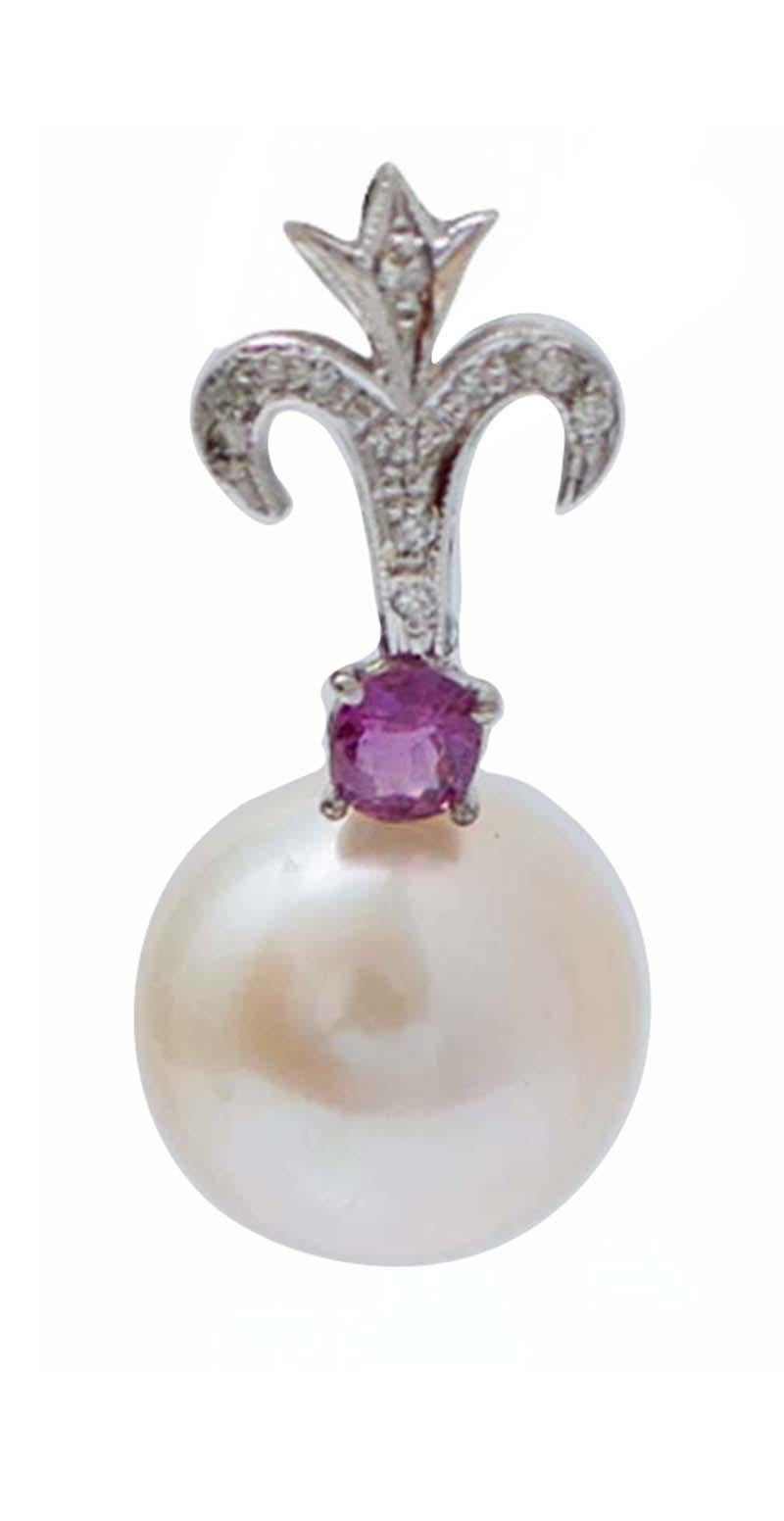 Fantastic dangle earrings in platinum structure mounted with diamonds; in the middle, a ruby and a pearl as pendant.
These earrings were totally handmade by Italian master goldsmiths and they are in perfect conditions.
Diamonds 0.18 ct
Rubies 1.00