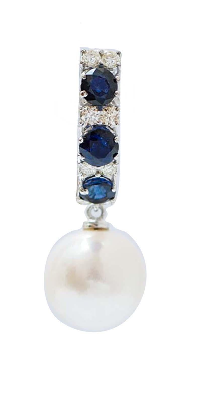 Fantastische Ohrringe aus 18-karätigem Weißgold, besetzt mit drei Saphiren, die sich mit Diamanten abwechseln, und einer Perle als Anhänger.
Diamanten 0,90 ct
Saphire 3,82 ct
Perlen 6.00 gr
Gesamtgewicht 10.40 gr
RF   G    UCRI

Für weitere