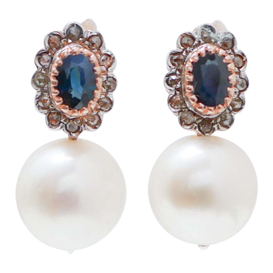 Orecchini da 13 mm con perle, zaffiri, diamanti, oro rosa e argento.