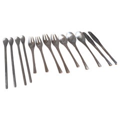Used 13 pc. Set of Retronue Stainless Steel Flatware