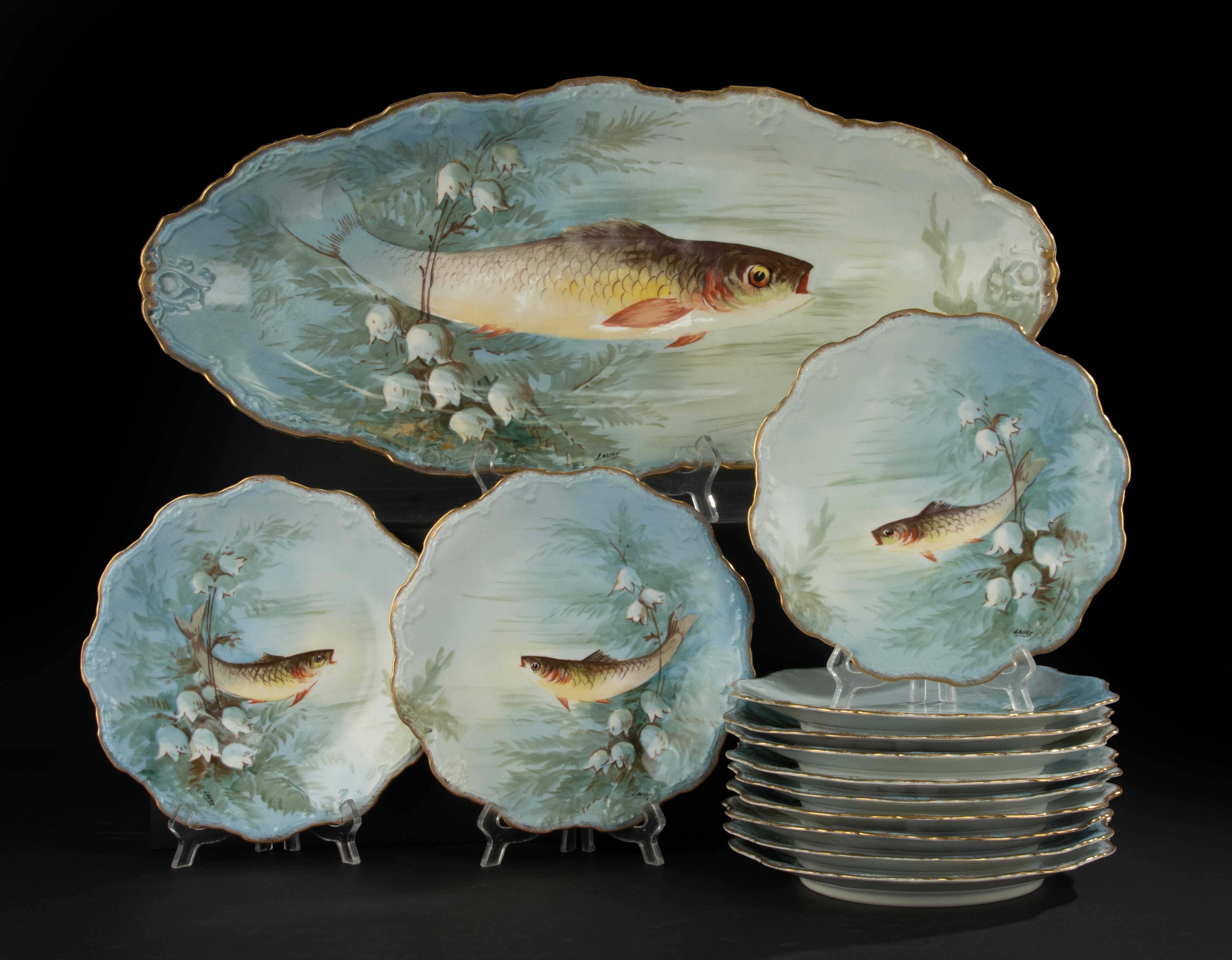 A beautiful antique porcelain fish tableware from the French brand Limoges.
The tableware is hand-painted with different images of all kinds of fish. The plates are also signed by the decorator.
It is a beautiful set, dating from around 1900.
What