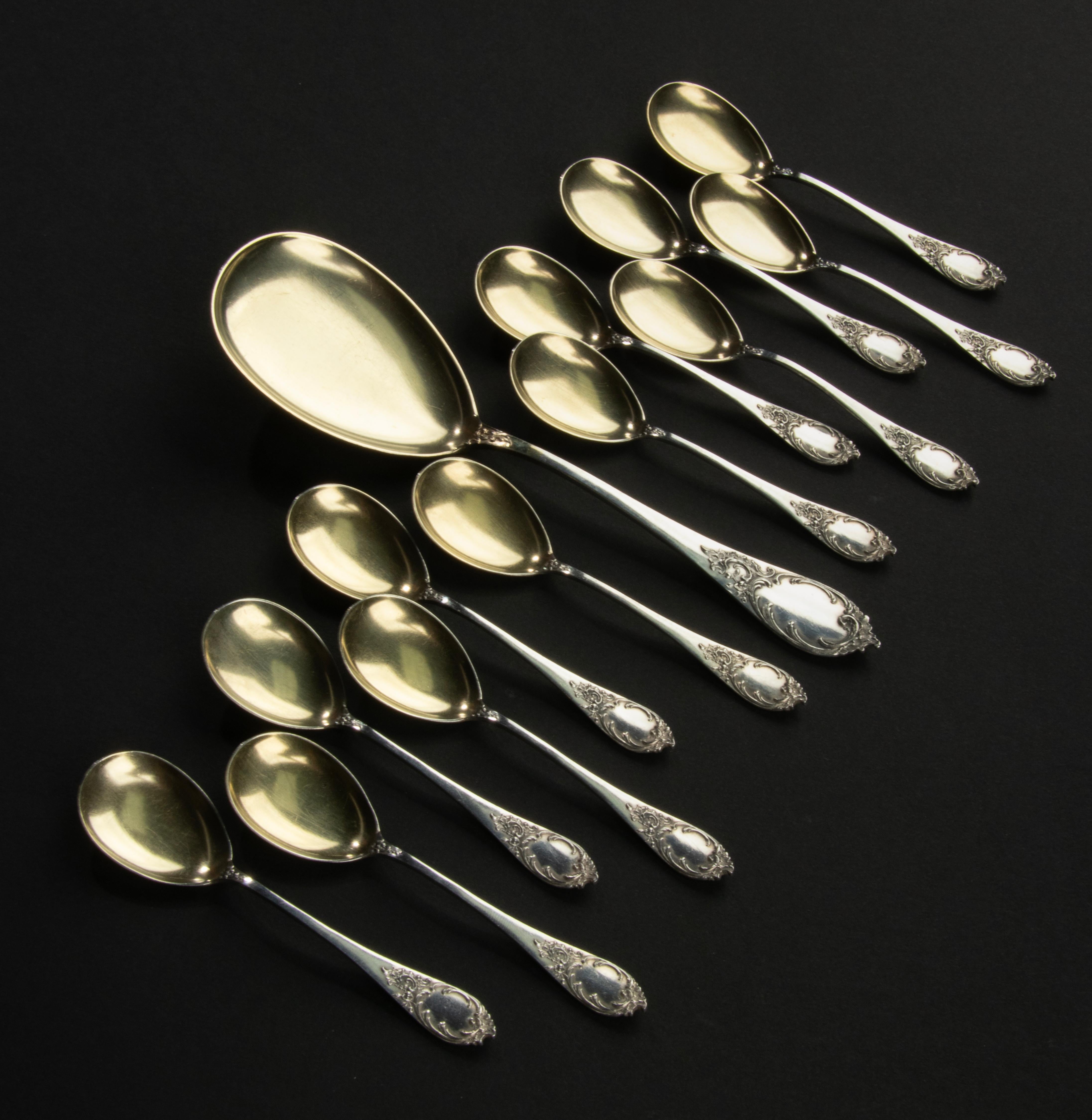 A lovely set of 12 silver ice cream spoons with a matching serving spoon. This cutlery is presumably French, dating from circa 1890-1900. The spoons are marked 800.
The scoops are gilded. The set is in very nice condition.