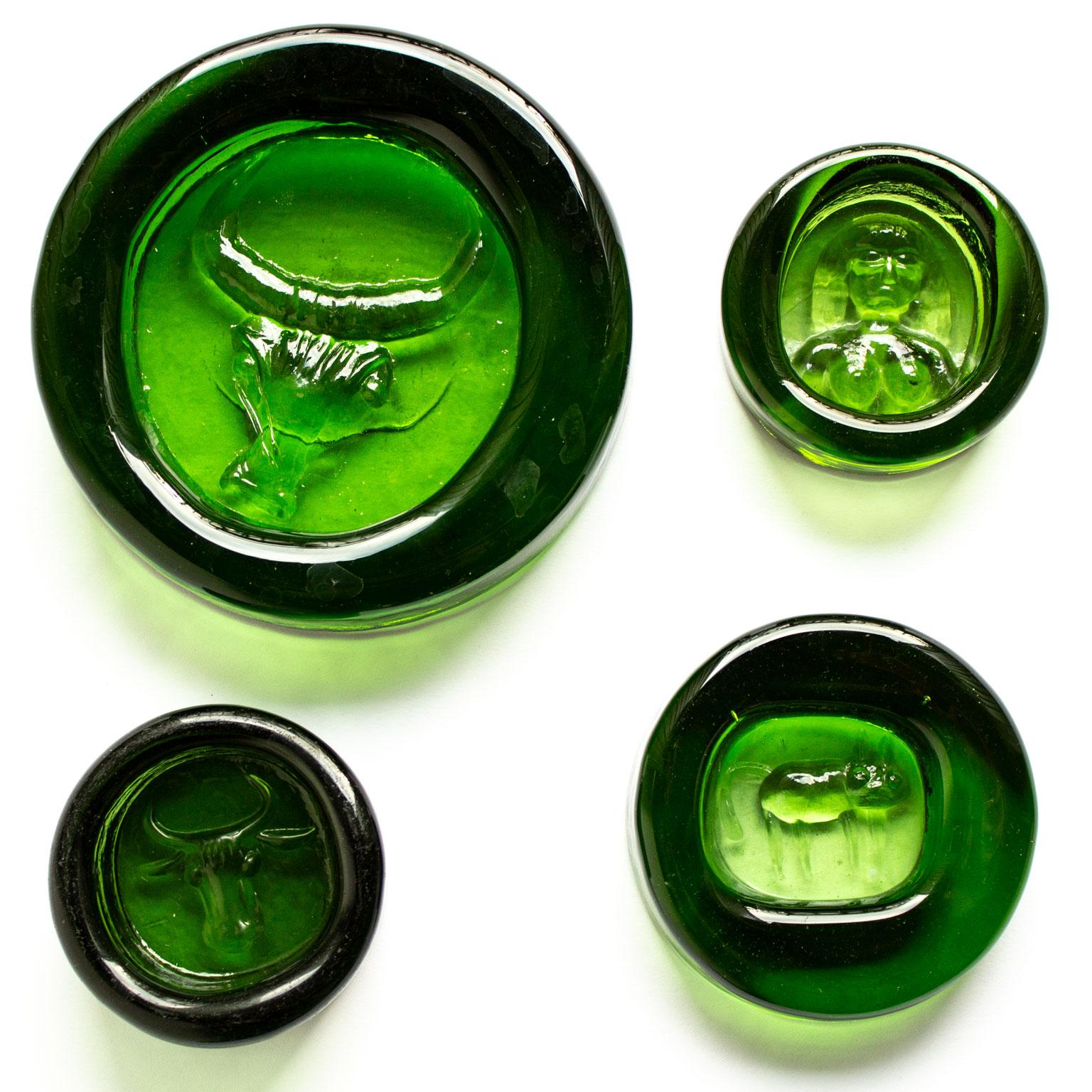 Scandinavian Modern 13 glass pieces by the Swedish Enfant Terrible Erik Höglund for Boda. Between 7-14 cm diameter. These pieces can be displayed as sculptures in a window or used as plates for herbs or salt.

Erik Höglund developed his own