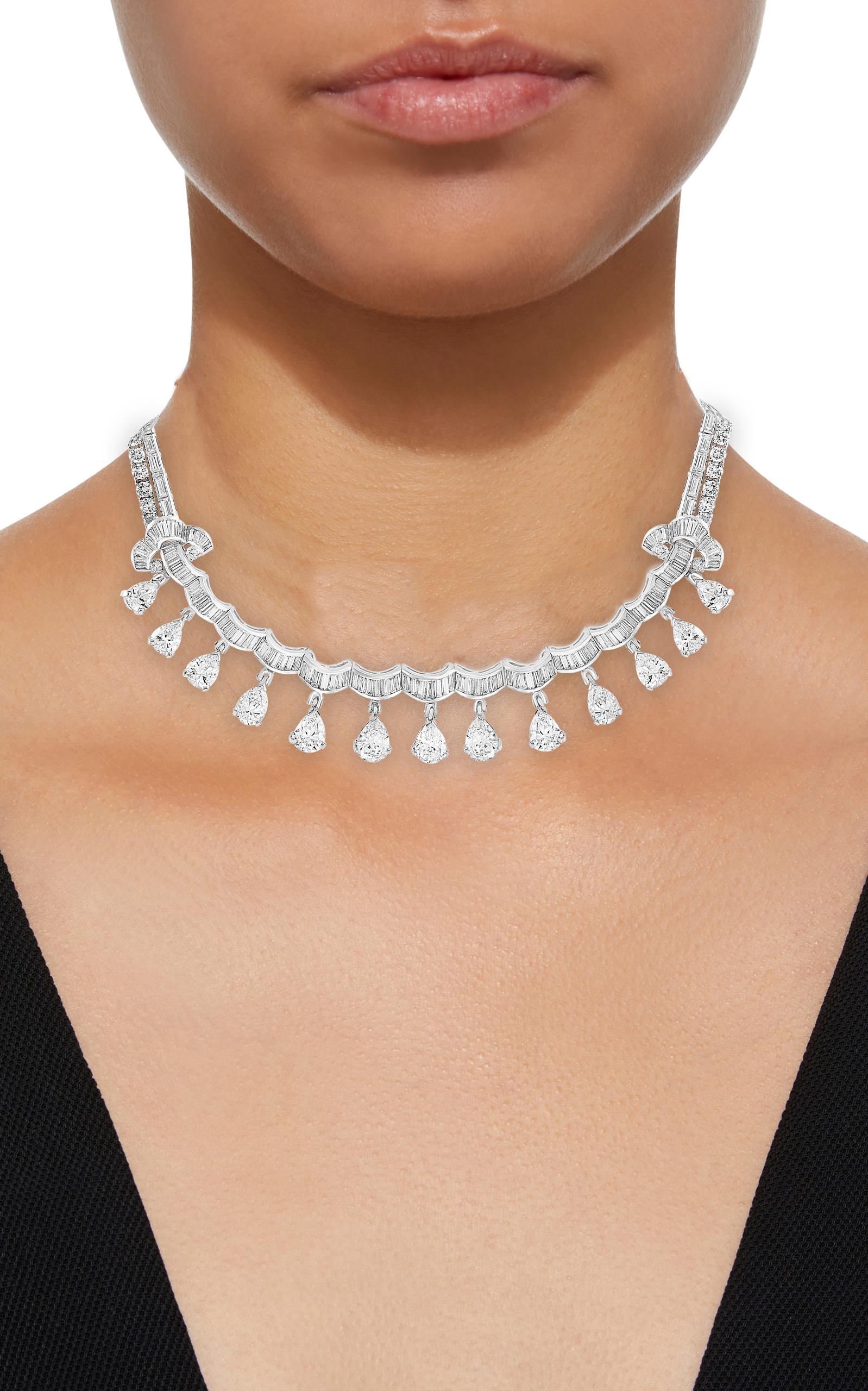 35 Carats VS, E Pear, Baguettes and Round cut Diamond Necklace in Platinum
A resplendent piece from the 1930's comprised of several magnificent brilliant-cut, pear-shaped and Baguettes diamonds weighing approximately 35 carats, elegantly crafted in