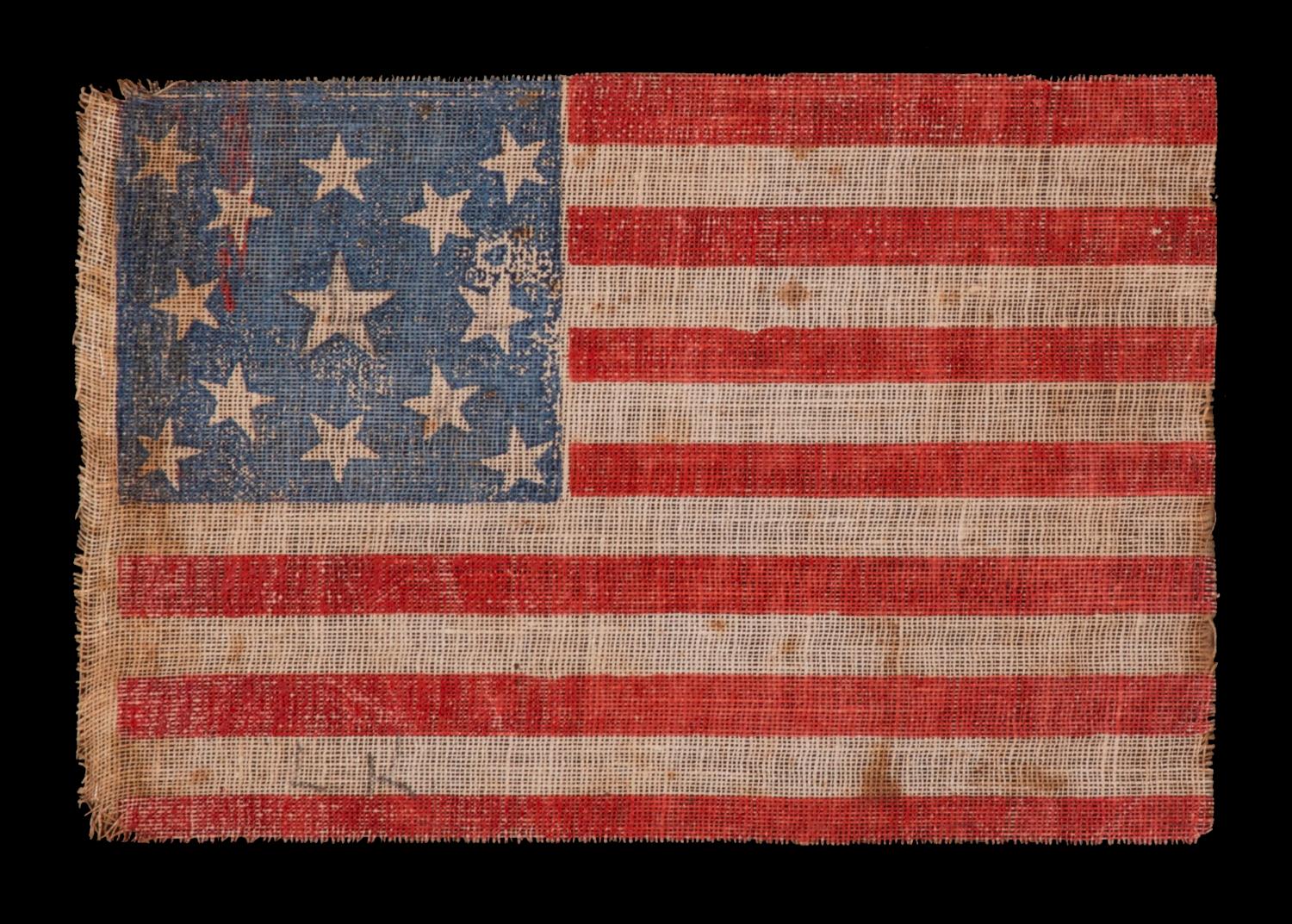 13 stars in a medallion pattern on an antique American parade flag, made for the 1876 centennial of American independence; an extremely scarce example with nice folk qualities

13 star American national parade flag, printed on coarse, glazed