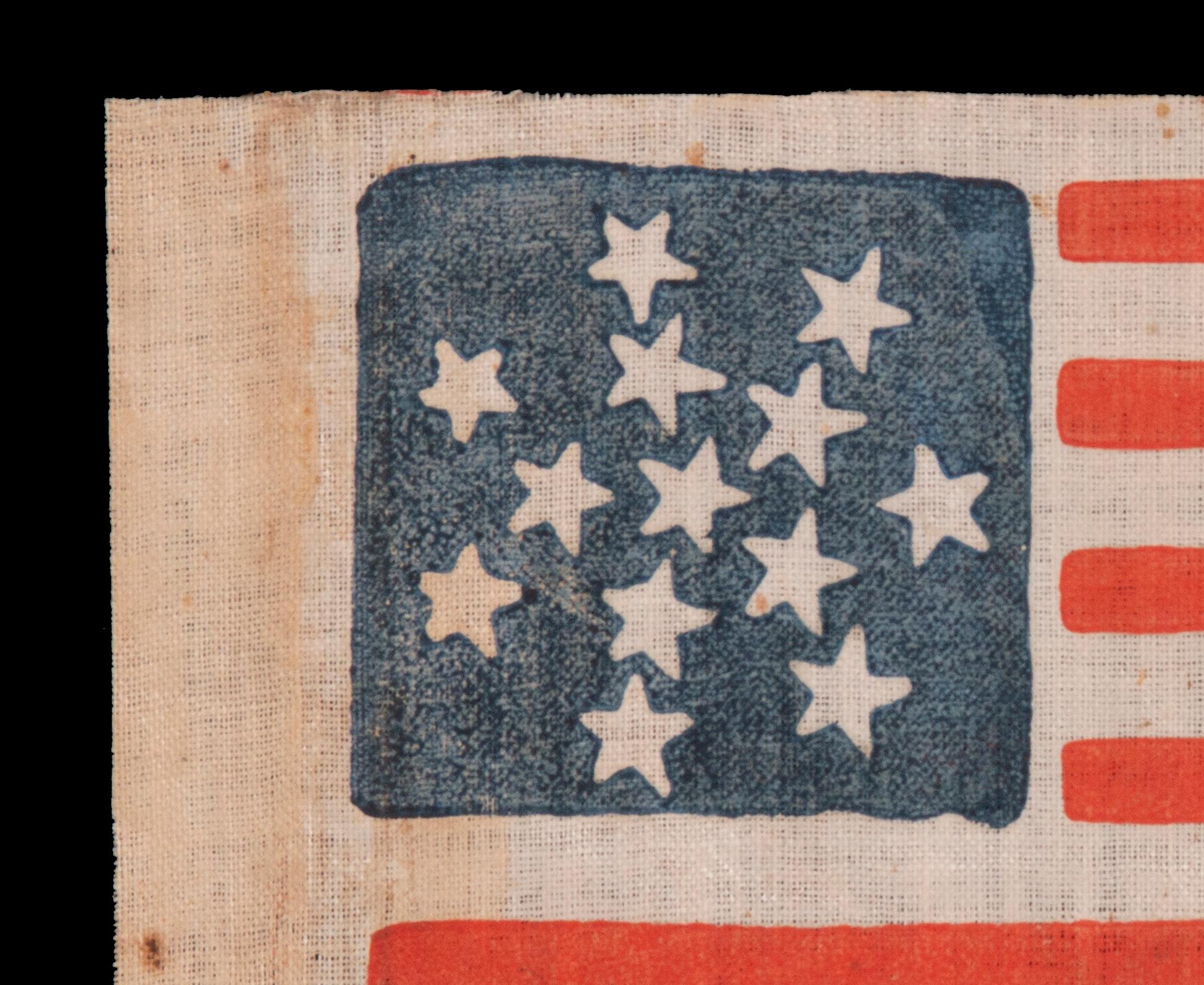 13 STAR ANTIQUE AMERICAN PARADE FLAG, DATING TO THE CIVIL WAR PERIOD (1861-1865), OR PERHAPS PRIOR, WITH AN EXCEPTIONALLY RARE & BEAUTIFUL SNOWFLAKE MEDALLION CONFIGURATION

13 star American national flag, printed on glazed cotton, with a very rare