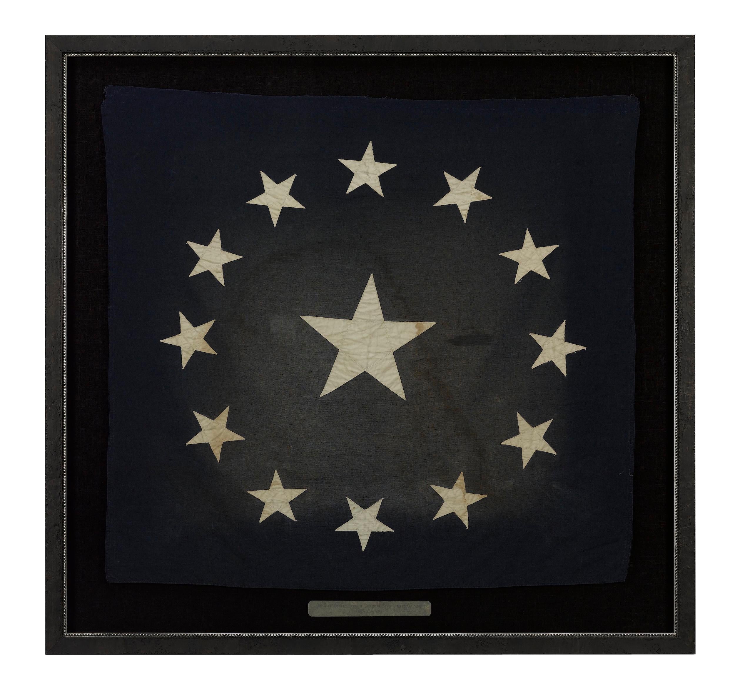 Presented is a stunning and large 13-star canton, from a Cowpens style American flag, dating to the 19th century. The canton has 13 machine-sewn white stars on a dark blue field. The stars are configured in the “Third Maryland” or “Cowpens” pattern,