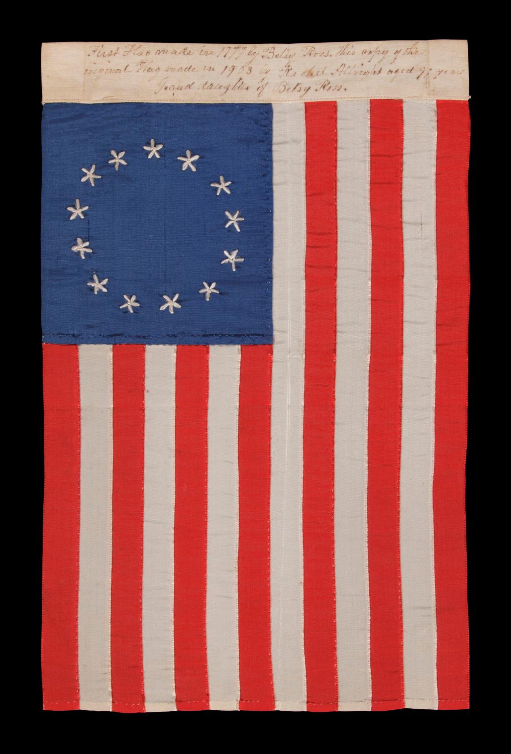 13 HAND-EMBROIDERED STARS AND EXPERTLY HAND SEWN STRIPES ON AN ANTIQUE AMERICAN FLAG MADE IN PHILADELPHIA IN BY RACHEL ALBRIGHT, GRANDDAUGHTER OF BETSY ROSS, SIGNED AND DATED 1903:

13 star American national flag, entirely hand sewn by Rachel Wilson