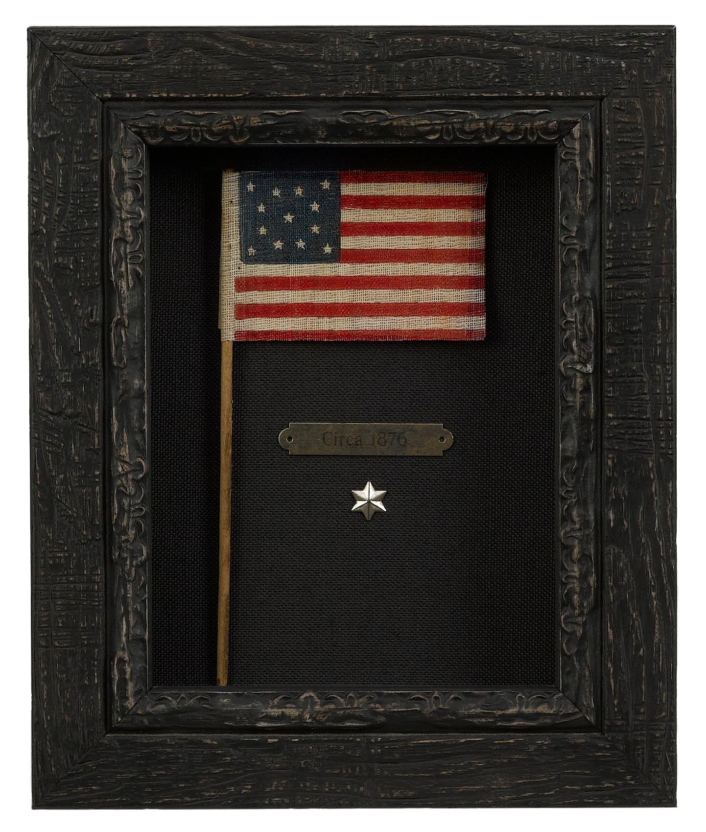 This small charming 13-star flag waver was made for and sold during the nation’s Centennial celebration in Philadelphia in 1876. All manner of flags were made for the official Centennial International Exposition, which was a World’s Fair event of