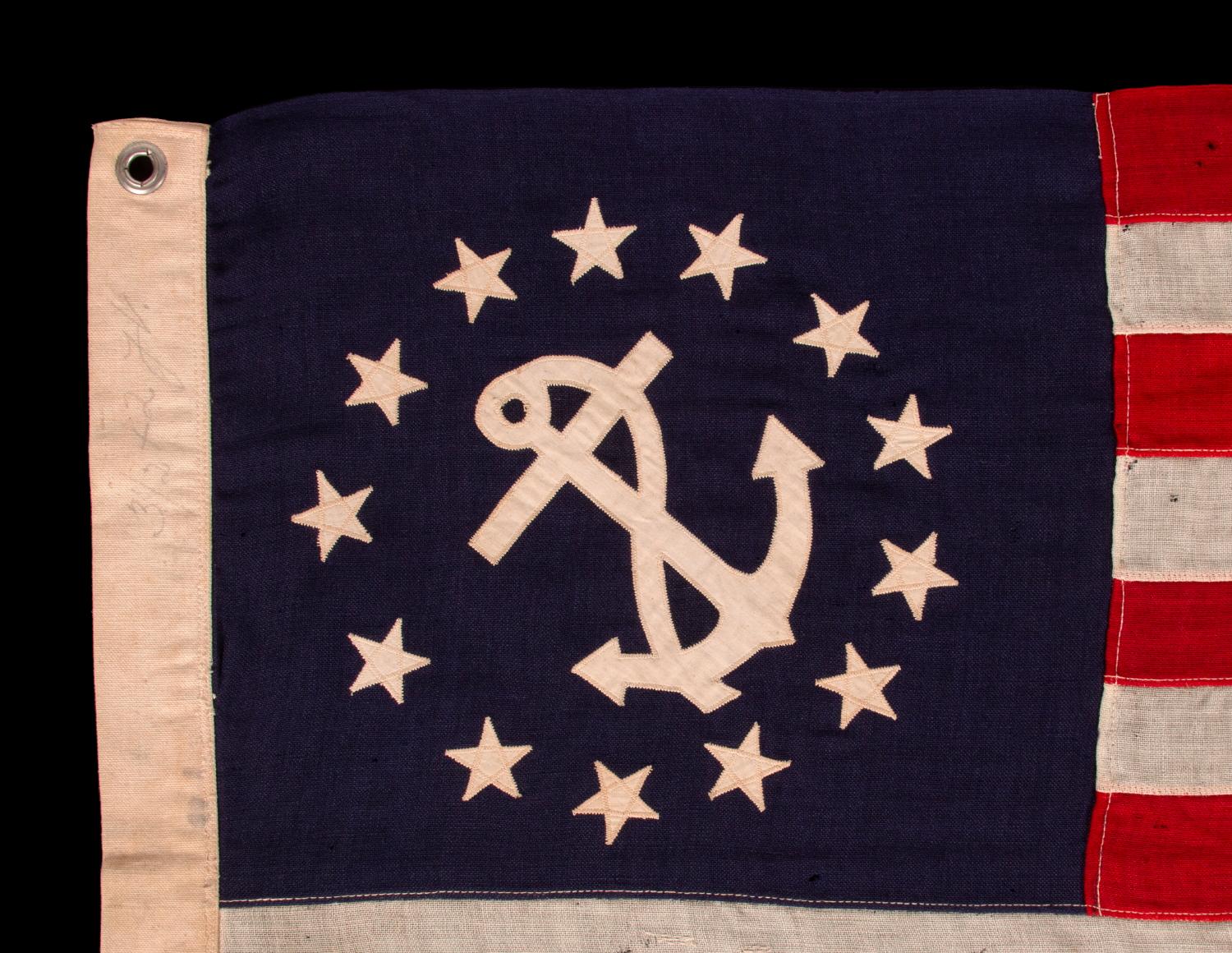 american flag with circle of stars and anchor
