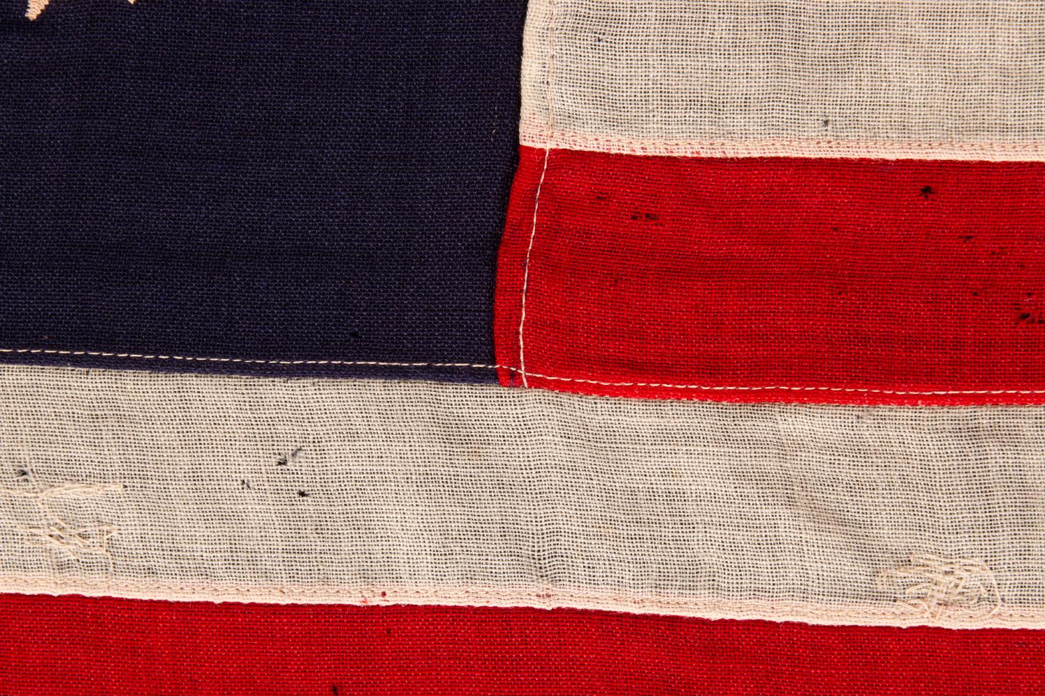 american flag with circle stars and anchor