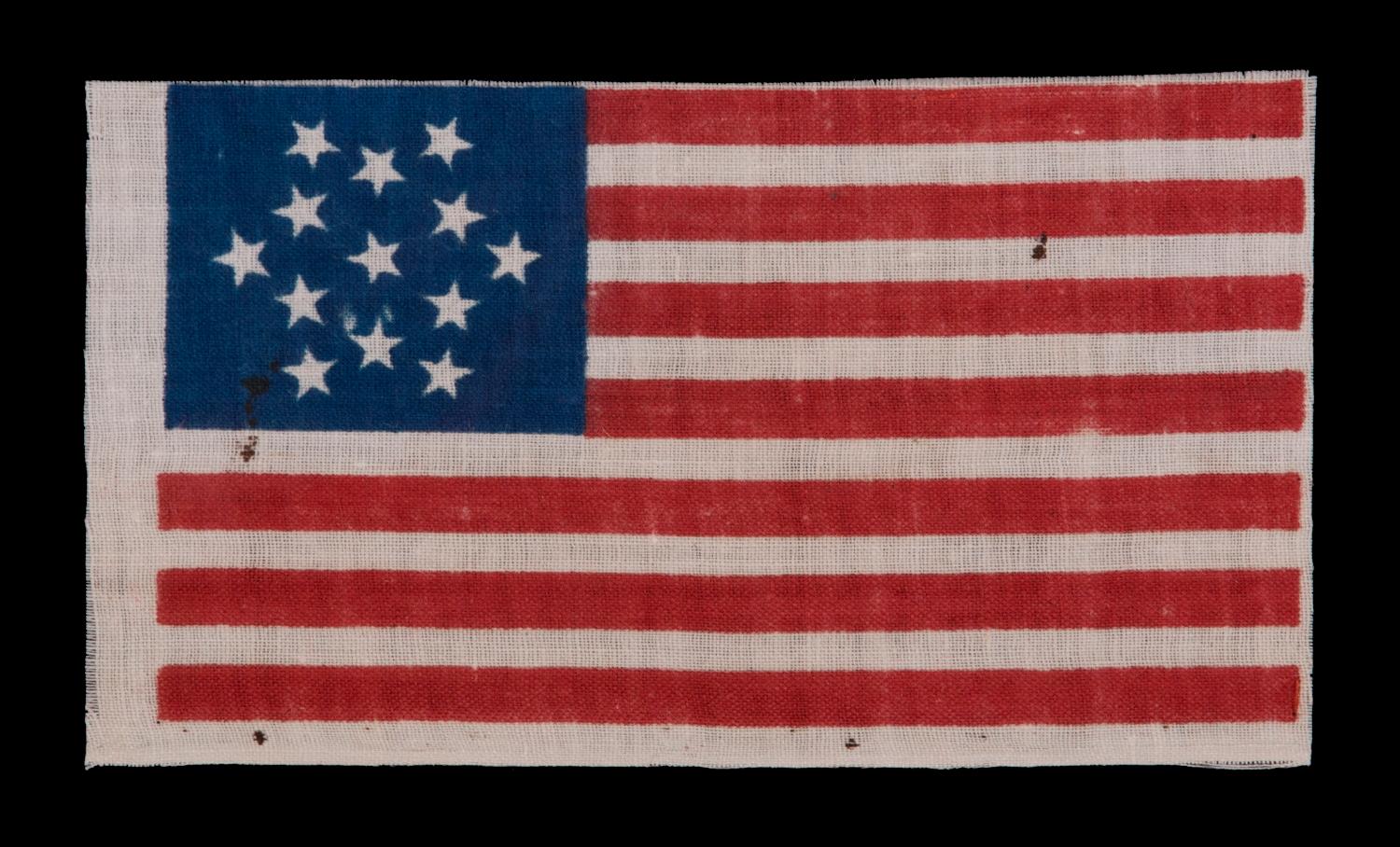13 STARS IN A SIX-POINTED GREAT STAR/ STAR OF DAVID PATTERN, MADE FOR THE 1876 CENTENNIAL OF AMERICAN INDEPENDENCE

13 star American national parade flag, printed cotton. The stars are arranged in a six-pointed version of what is known as the