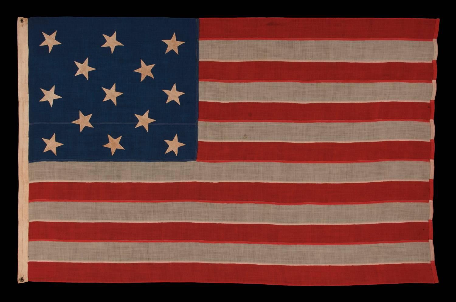 13 hand-sewn stars In A 3-2-3-2-3 pattern on an antique American flag of the 1876 Centennial era, possibly a U.S. Navy small boat ensign:

Despite the fact that America hasn't been comprised of 13 states since 1791, 13 star flags have been made