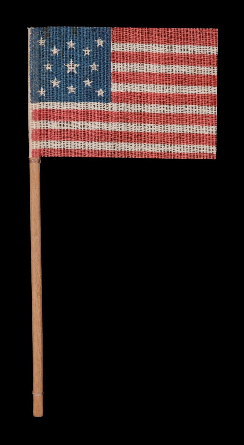 13 stars in a medallion pattern on an antique American parade flag made for the 1876 Centennial Celebration

13 star American national parade flag, printed on coarse, glazed cotton and affixed to its original staff. Made to celebrate our nation’s