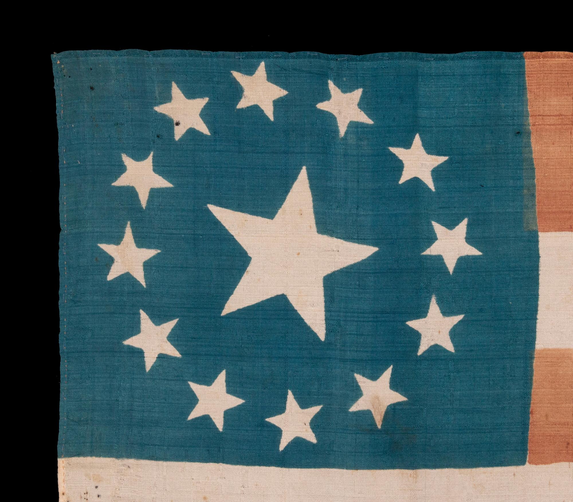 13 STARS ON A FLAG MADE FOR THE 1840 PRESIDENTIAL CAMPAIGN OF WILLIAM HENRY HARRISON, WITH THE INCLUSION OF A THREE-COLOR PORTRAIT MEDALLION, IN VIOLET , GOLD, AND BLACK; AMONG THE EARLIEST OF ALL PRINTED FLAGS KNOWN TO EXIST; REFLECTS THE VERY