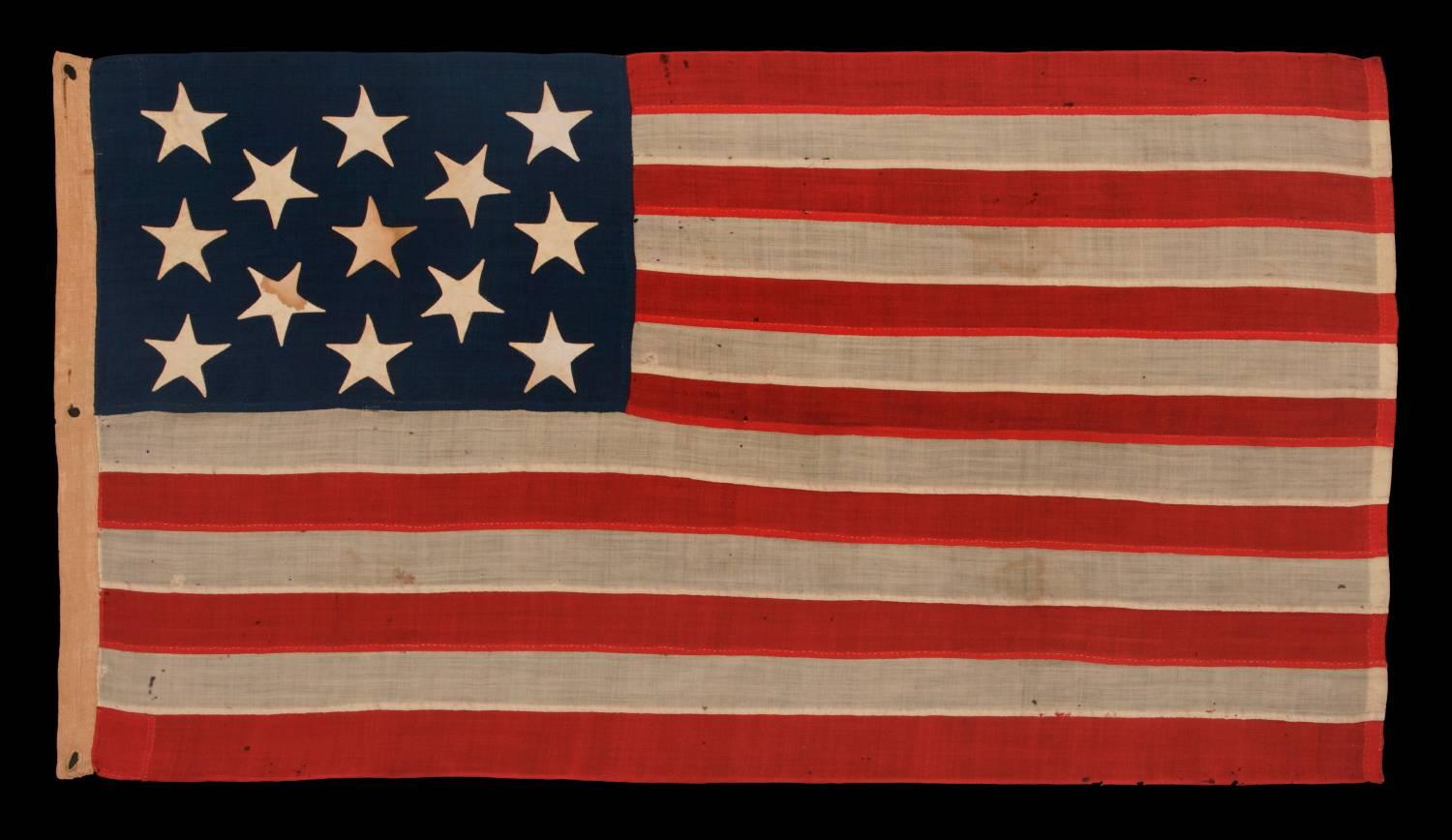 13 stars on a U.S. Navy small boat ensign, entirely hand-sewn, probably made between 1882 and 1884, a beautiful example in a remarkable state of preservation:

Despite the fact that America hasn't been comprised of 13 states since 1791, 13 star