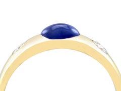 1.30 Carat Blue Sapphire and Diamond Yellow Gold Three-Stone Ring