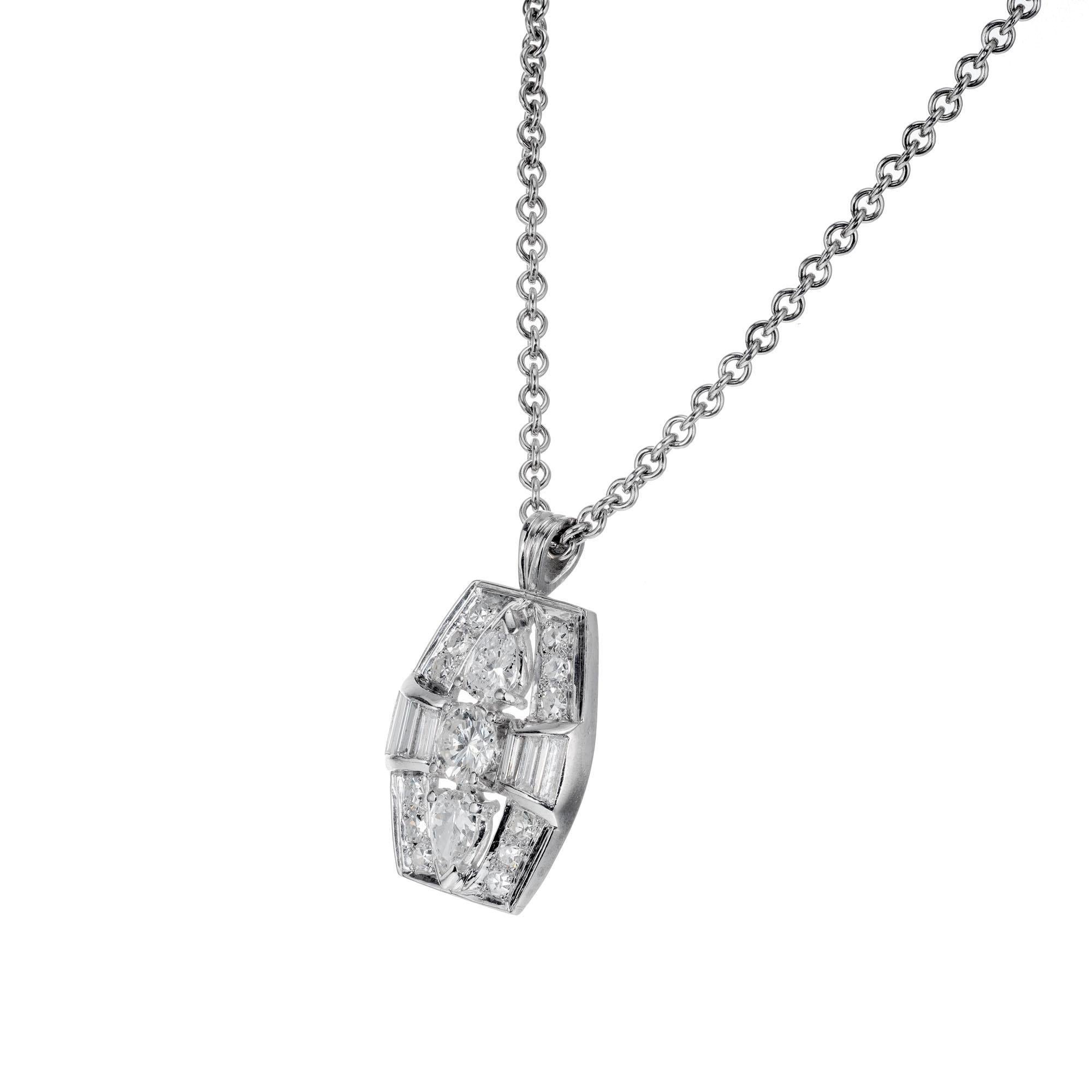 Retro style 1960’s diamond platinum pendant necklace with round, pear and baguette cut diamonds. Platinum cable link chain.

1 round brilliant cut diamond F-G SI, approx. .35cts
2 pear shape diamonds G SI-I, approx. .40cts
6 step cut baguette