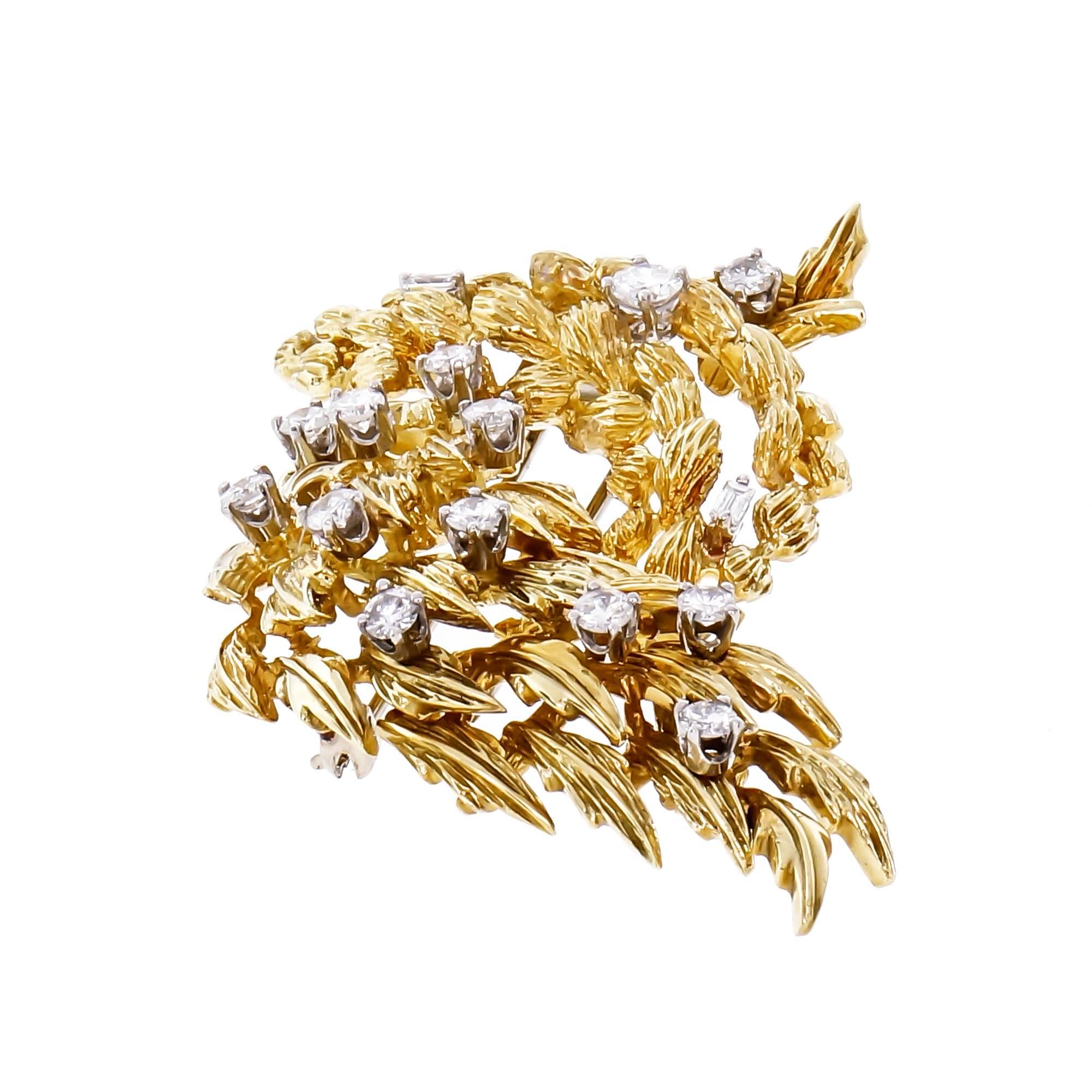 Vintage 1950s textured 18k yellow gold brooche with 2 hinged flexible sections set with brilliant cut and Baguette Diamonds. 

2-tone 18k gold
13 round Diamonds, approx. total weight 1.25cts, H – I, SI1 – I1
2 Baguette Diamonds, approx. total weight