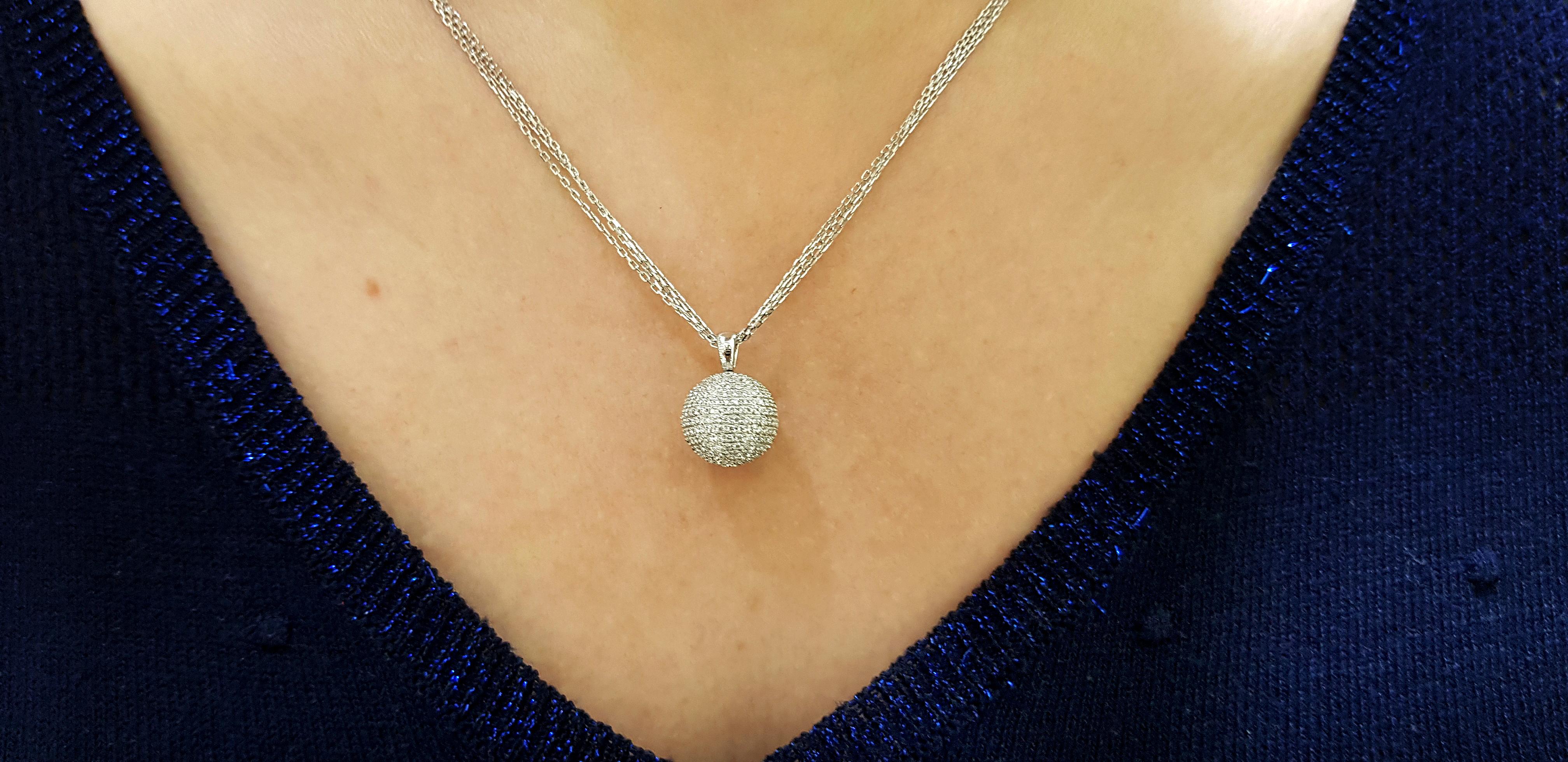 Illuminating and Luxurious, this outstanding quality 1.30 Carat Diamond and triple chain, 18 Karat White Gold Pendant with Beautiful classic Round Brilliant Cut white Diamonds, color G/H, clarity SI1. Sphere diameter is 0.50 inches (13 mm). Bespoke,