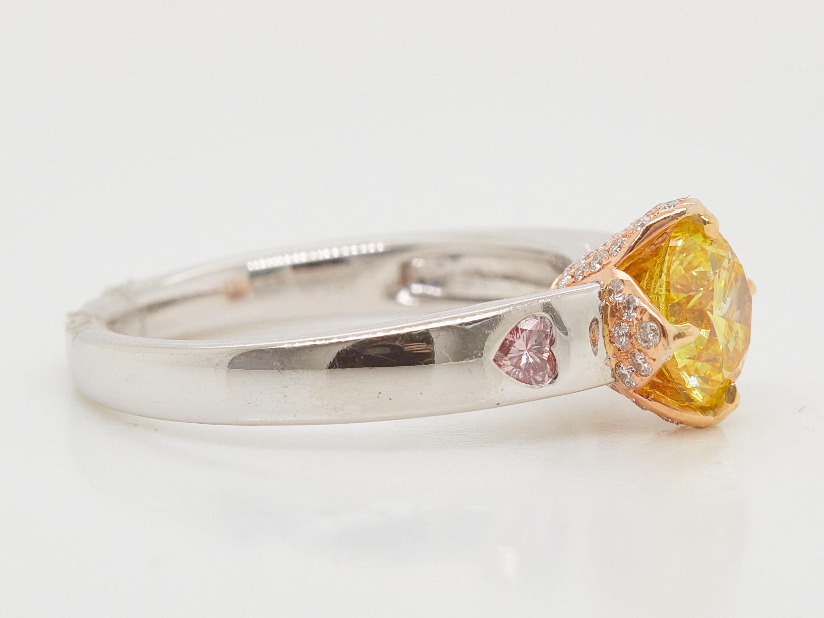 Contemporary 1.30 Carat Fancy Vivid Yellow Diamond Ring With Heart-shape pink Diamonds For Sale