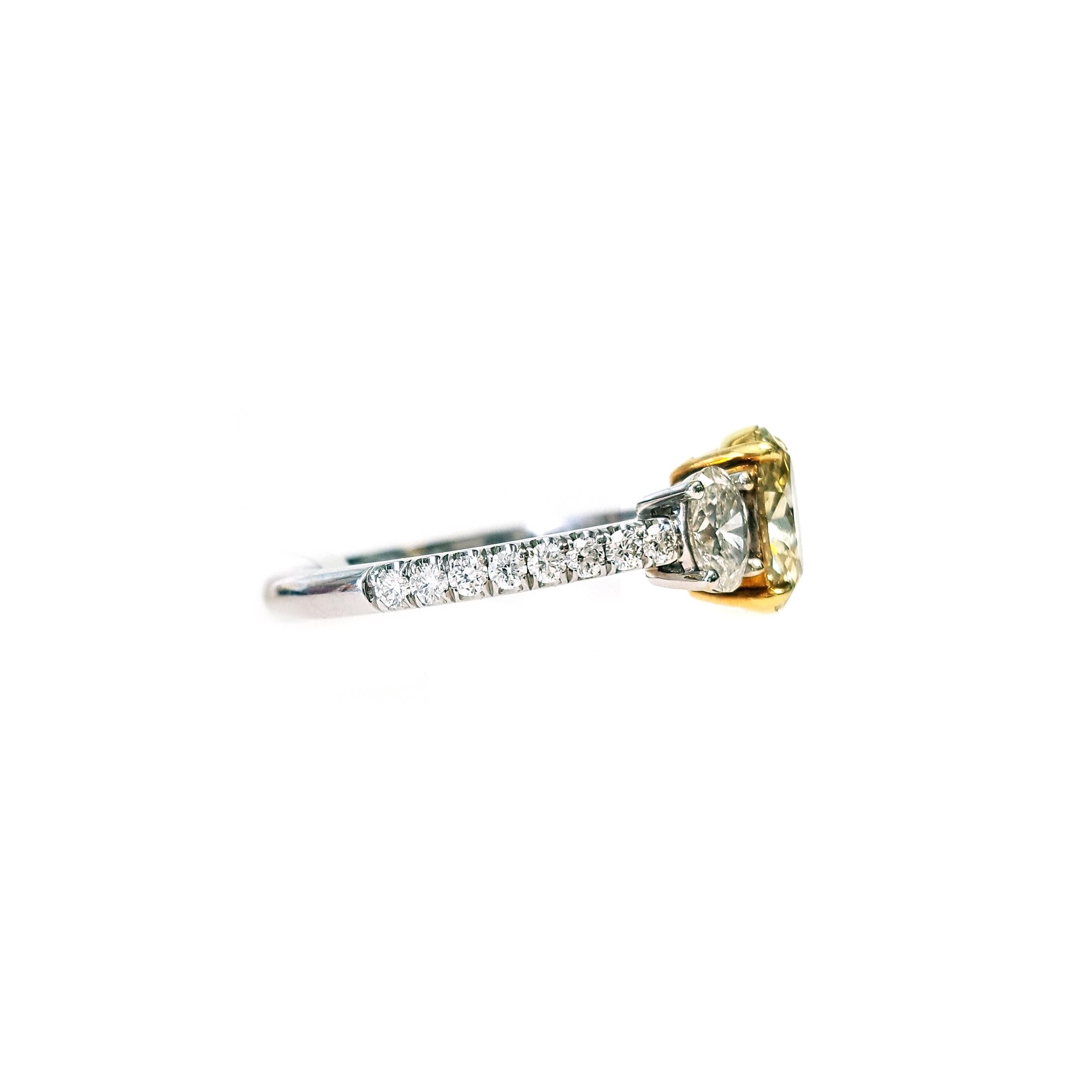 Oval Cut 1.30 Carat Fancy Yellow Oval Diamond Three-Stone Engagement Ring, GIA Certified. For Sale