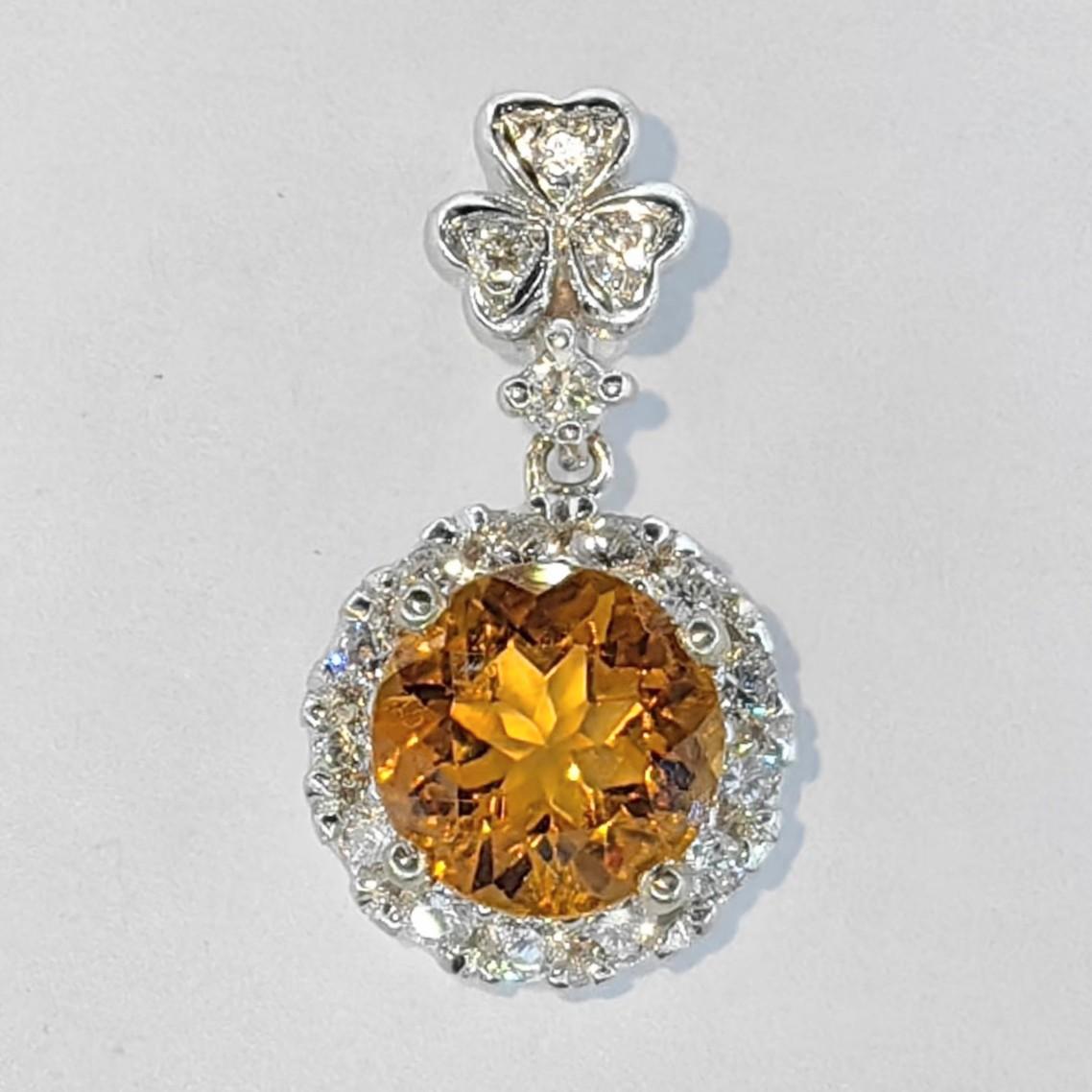 Introducing our exquisite 1.30 Carat Intense Golden Orange Citrine Diamond 18K White Gold Necklace Pendant, a captivating piece that radiates warmth and sophistication.

At the heart of this pendant lies a round-cut intense golden orange citrine