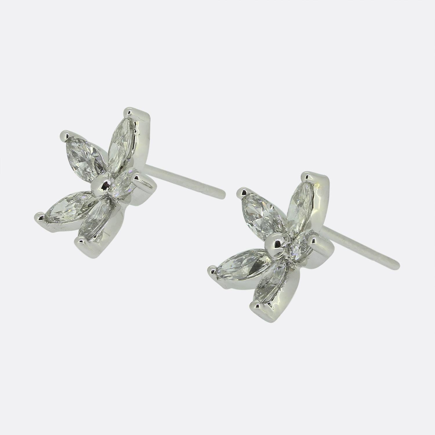Here we have a smart and sophisticated pair of diamond stud earrings meticulously crafted from 18ct white gold. These identical earrings feature a floral design with each petal formed by a marquise-cut diamond. The diamonds, expertly set, radiate a