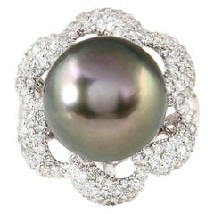 Anello con diamante e perla naturale dei mari del sud, oro bianco 14 carati