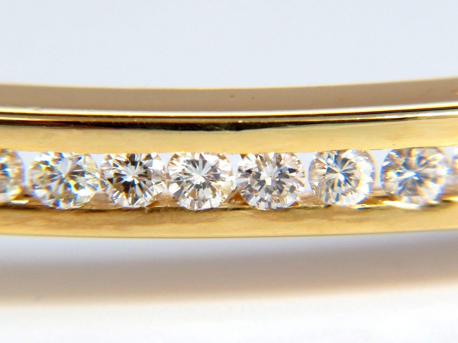 1.30ct. Natural diamonds bangle bracelet.

Channel set, smooth finish.

Rounds, full cut.

G / H color

Vs-2 / Si-1 clarity.

14kt. yellow gold 

14.1 Grams.

.15 inch wide

Made for 6.25-6.50 inch wrist

Double safety clasps.

$6,500 Appraisal