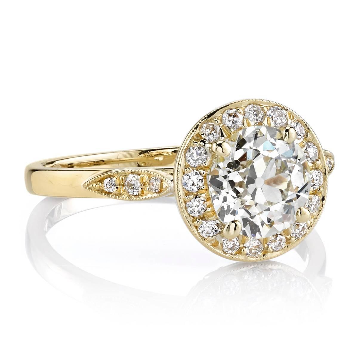 1.30ctw L/SI1 EGL certified old European cut diamond set in a handcrafted 18k yellow gold mounting with 0.16ctw accent diamonds. 

Ring is currently a size 6 and can be sized to fit.