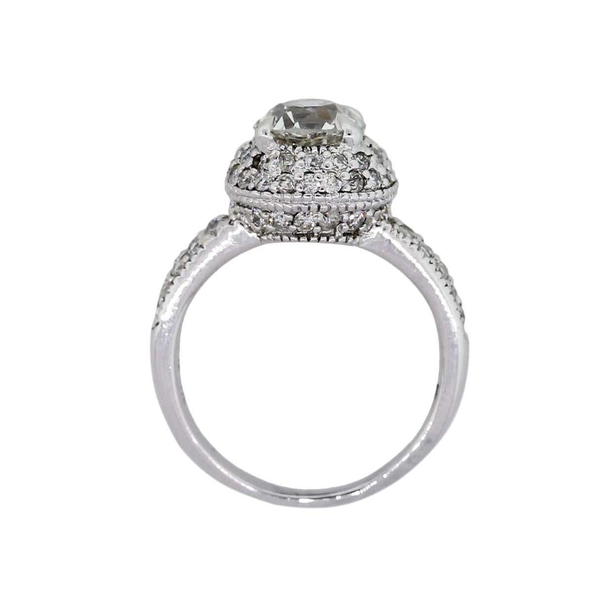 Material: 18k White Gold
Main Diamond Details: Old European round diamond approximately 1.30ct. Diamond is J in color and SI1 in clarity
Adjacent Diamond Details: Approximately 1ctw of round brilliant diamonds. Diamonds are G/H in color and VS in