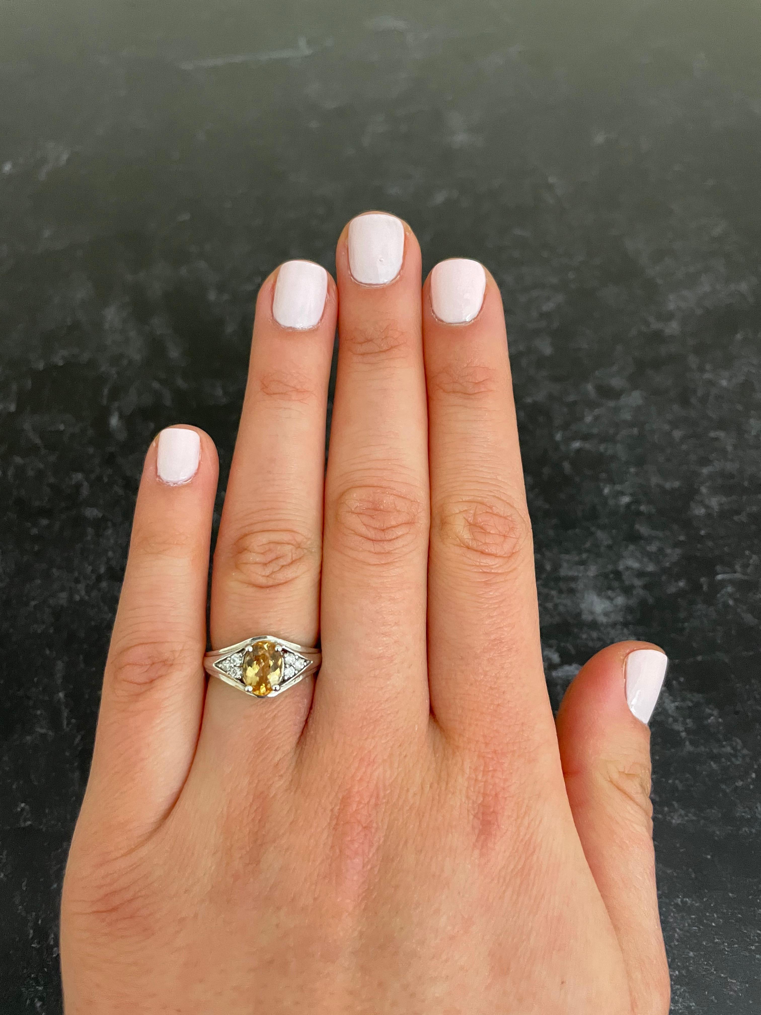 Metal: 14K White Gold
Center Stone: 1 Oval Imperial Topaz at 1.30 Carats - Measuring 8 x 6 millimeters
Side Stones: 6 Round Brilliant White Diamond 0.13 Carats Total Weight

Alberto offers complimentary ring sizing on all rings!

Fine one-of-a-kind